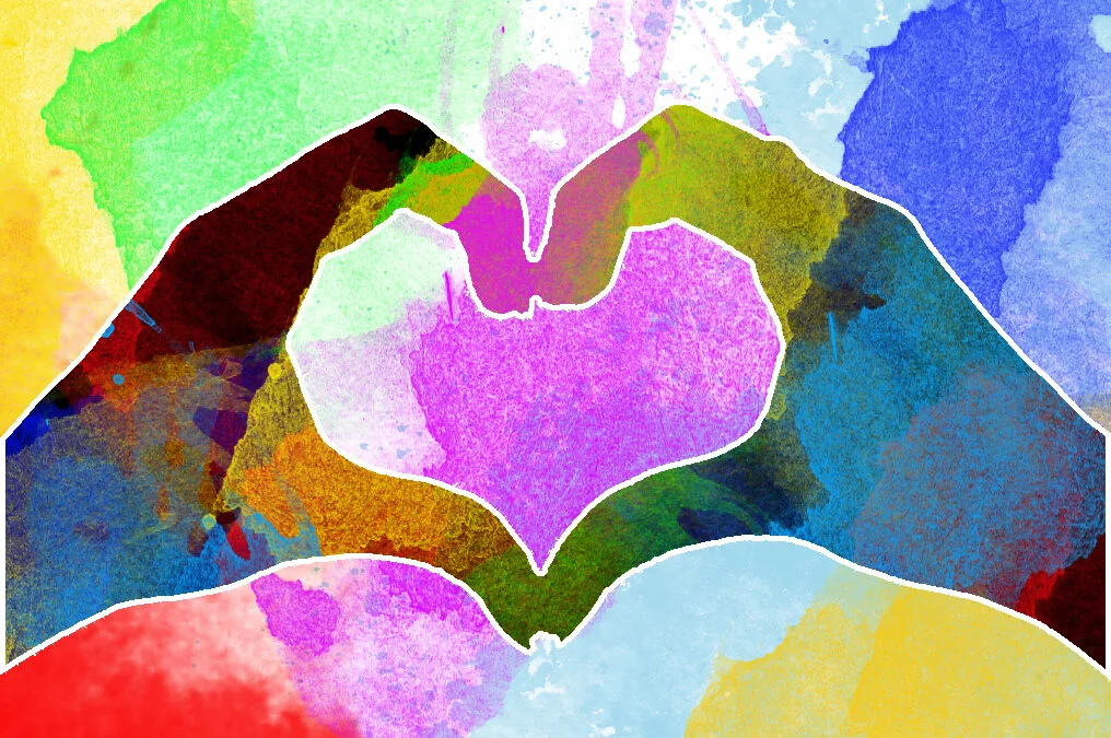 Colourful graphic of two hands creating a heart in Kids Inspire colours.