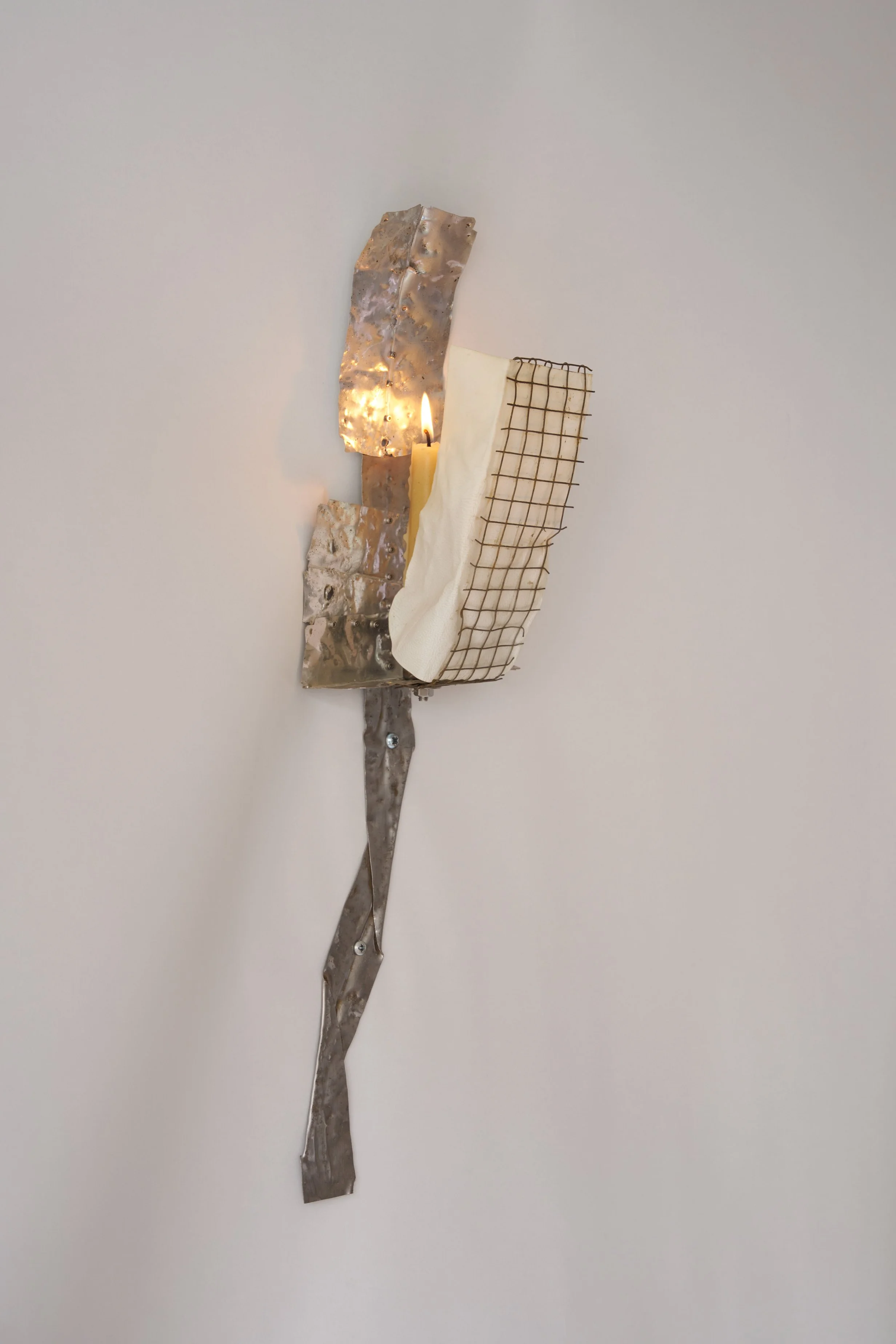 Kira Freije, cattle, 2024. Steel, tin, vellum, candle, 54 x 15 x 14 cm. 