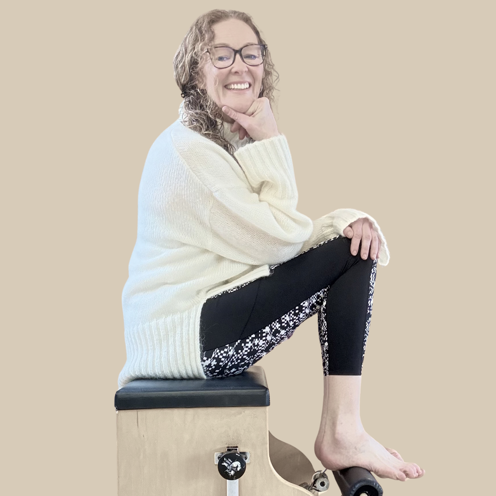 Lynda Power sitting on a Wunda Chair smiling to the camera