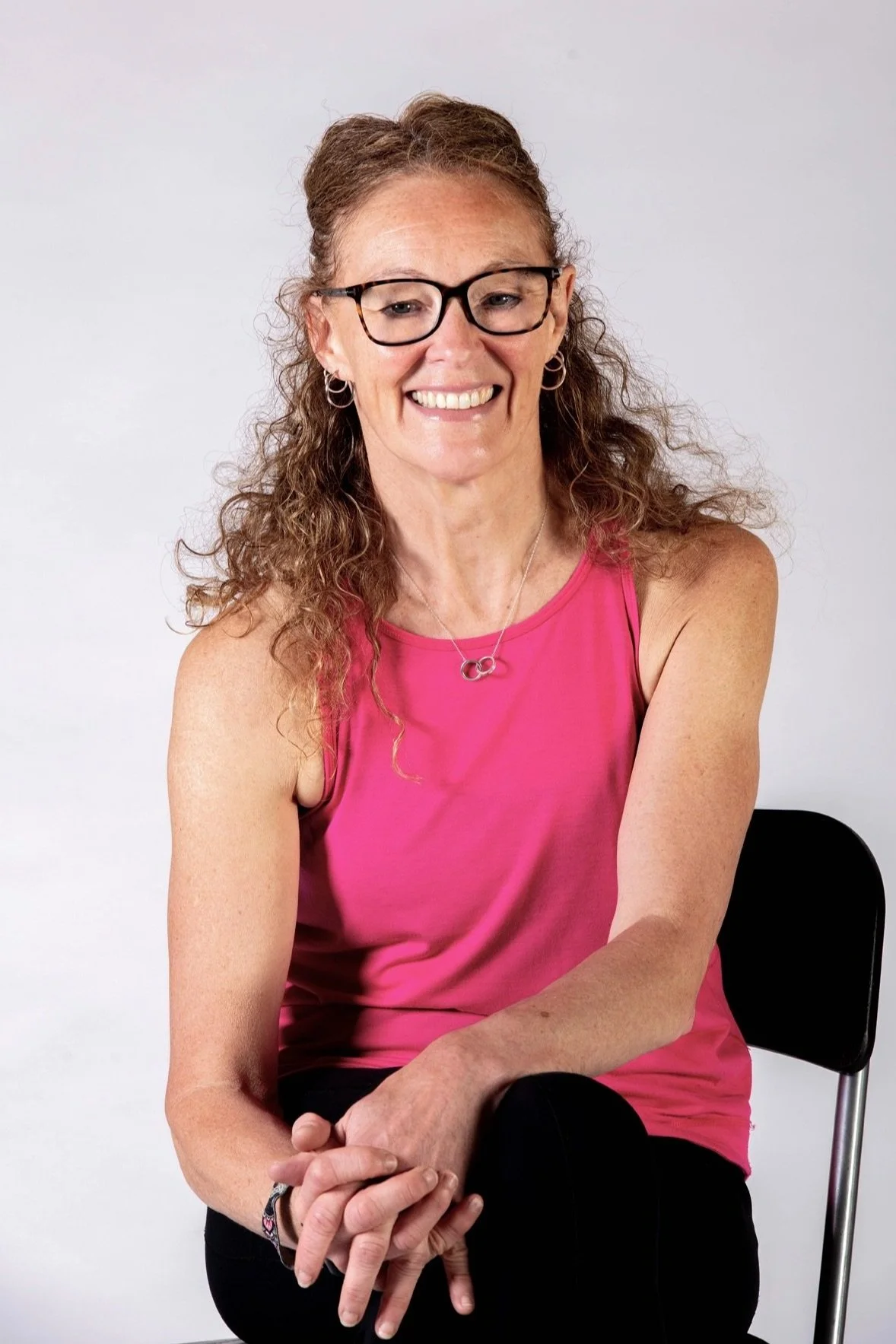 Lynda Power sitting smiling at the camera