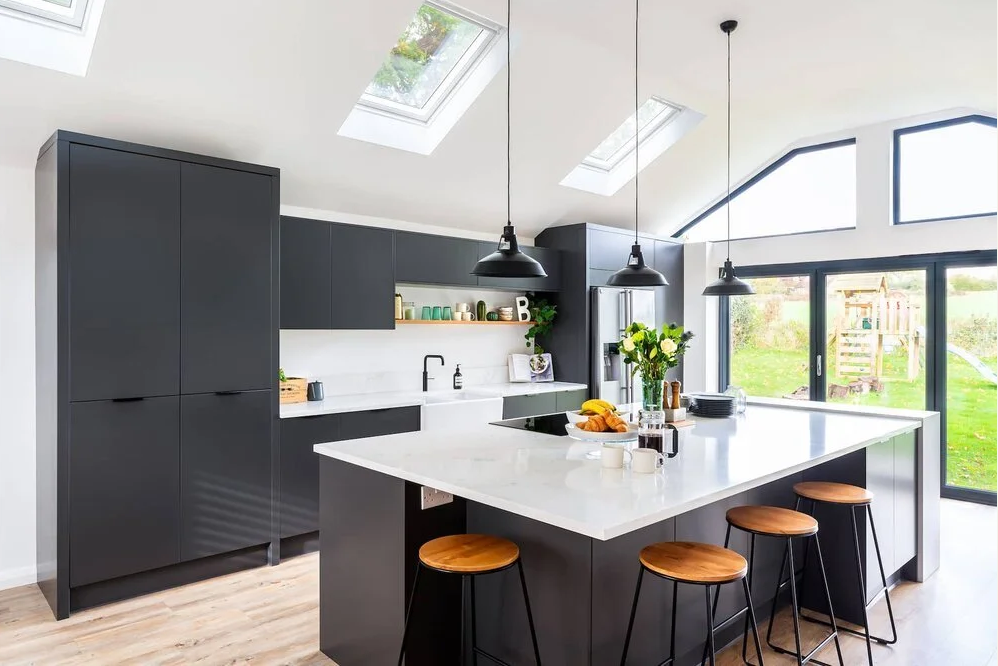 A dark grey Nolte kitchen with island