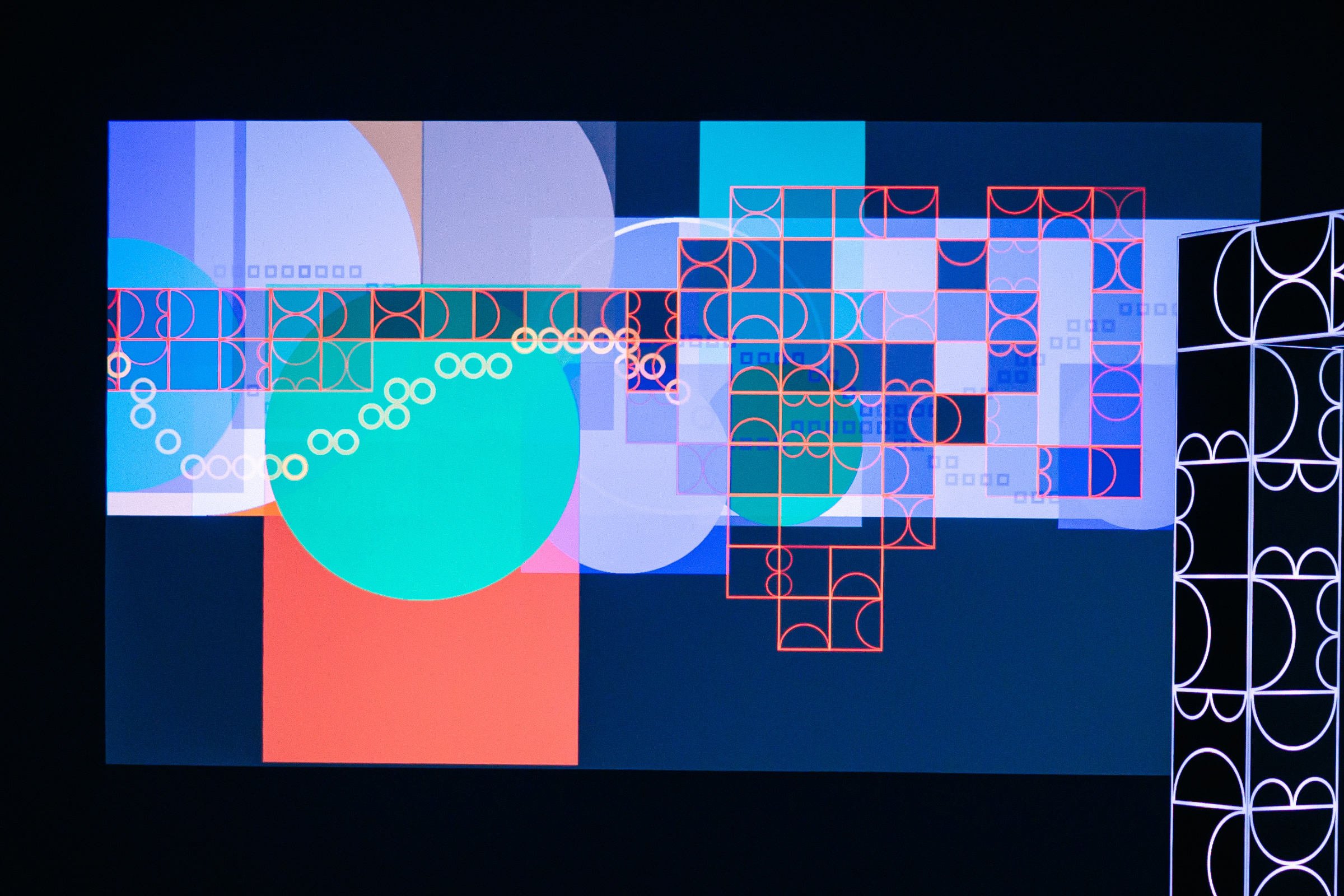 Installation view of shemza.digital #4–7, an interactive projection artwork inviting visitors to co-create evolving digital paintings.