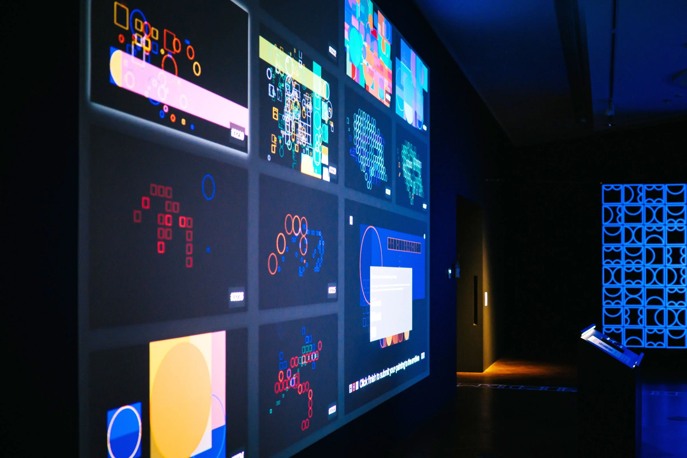 Side view of shemza.digital #8, an interactive projection artwork displaying a continuously growing archive of public-created digital paintings.