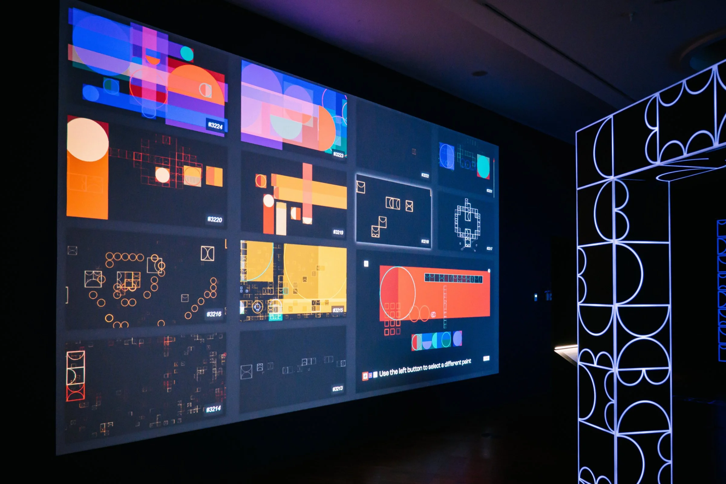 image of shemza.digital #8, an interactive digital artwork featuring a live archive of public-created digital paintings projected onto a gallery wall.