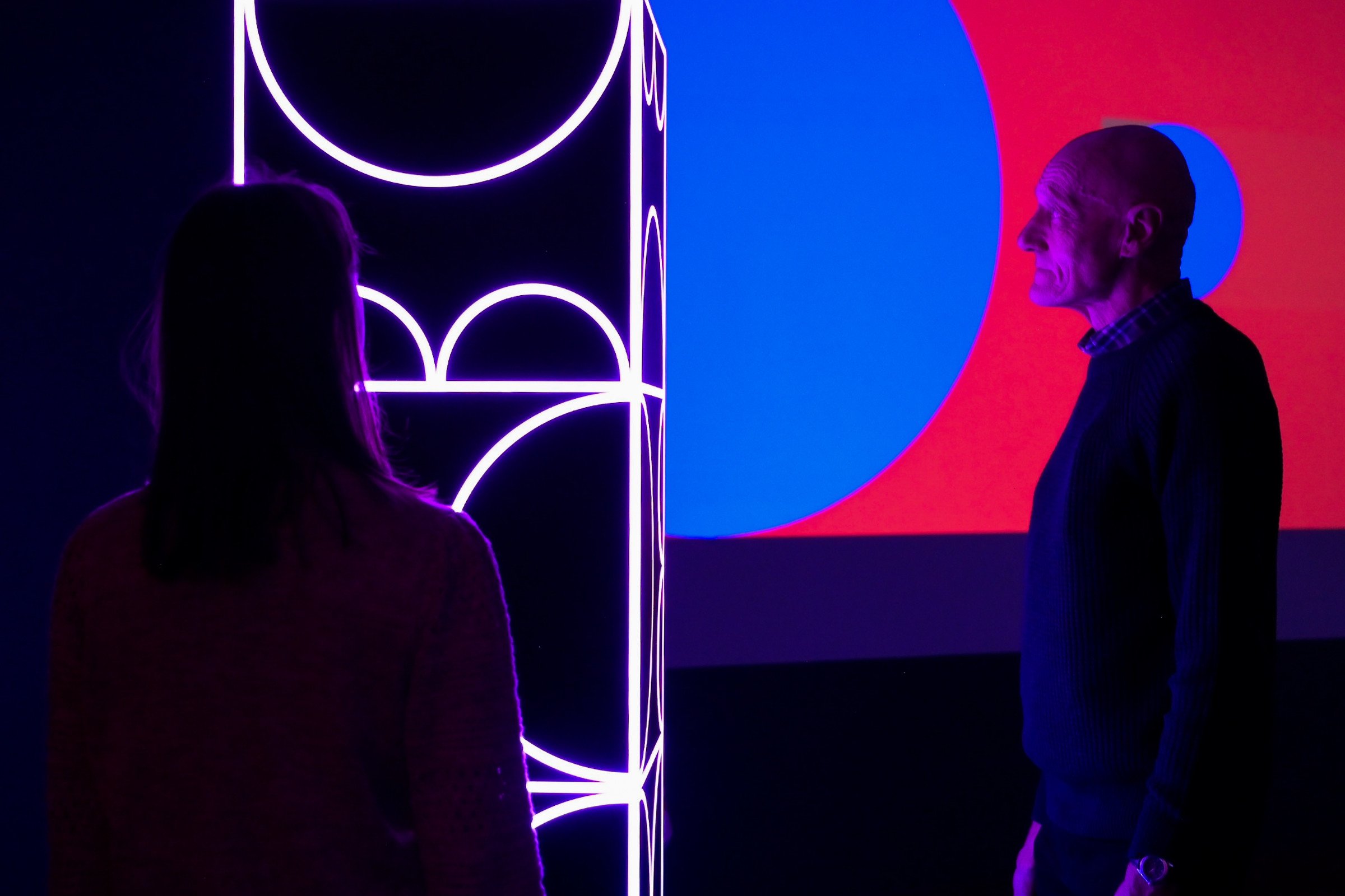 Visitors exploring shemza.digital #6, demonstrating how the sculpture responds to audience movement and proximity.