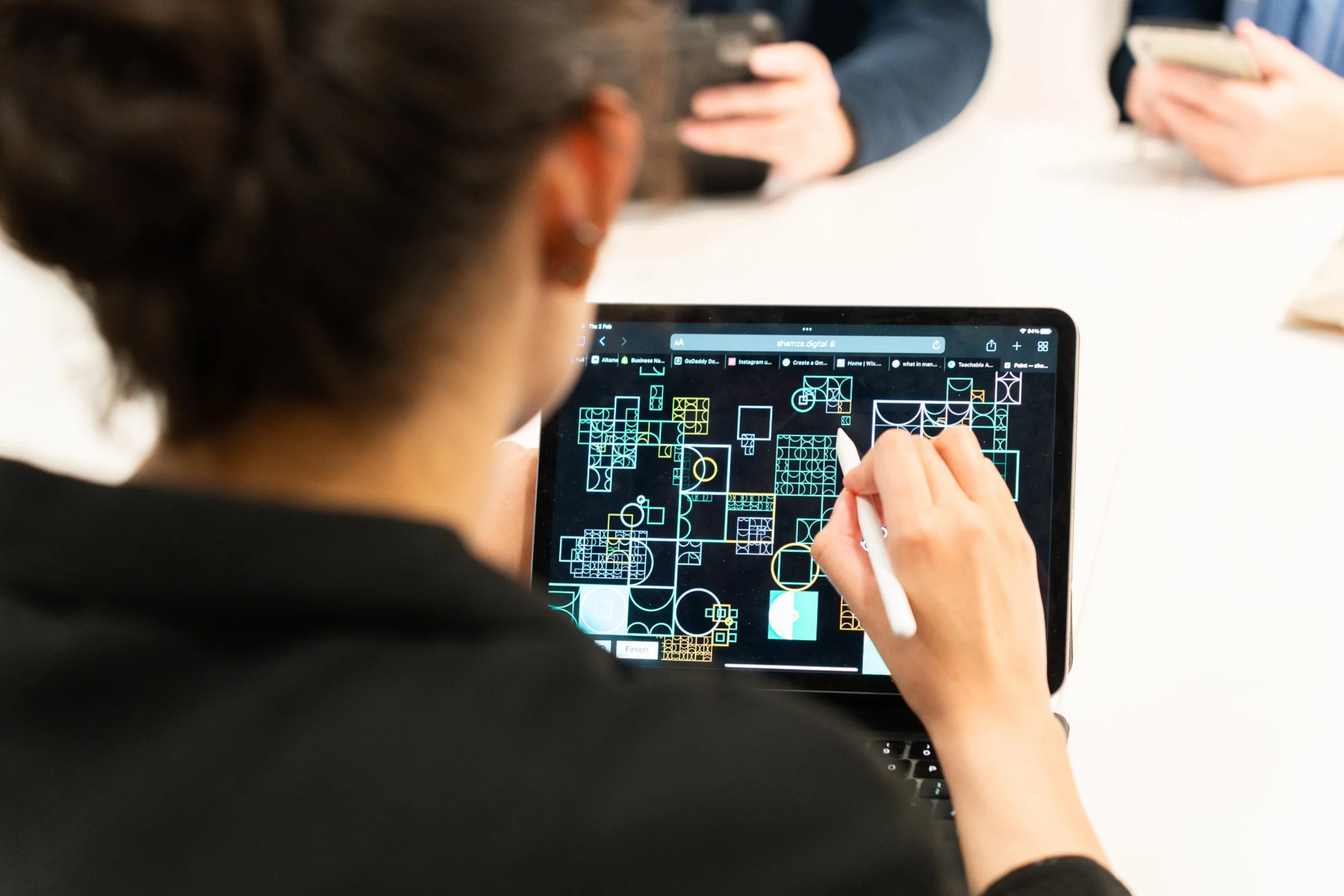 Workshop participant using the interactive digital painting application to create artwork for shemza.digital #15 at MIMA.