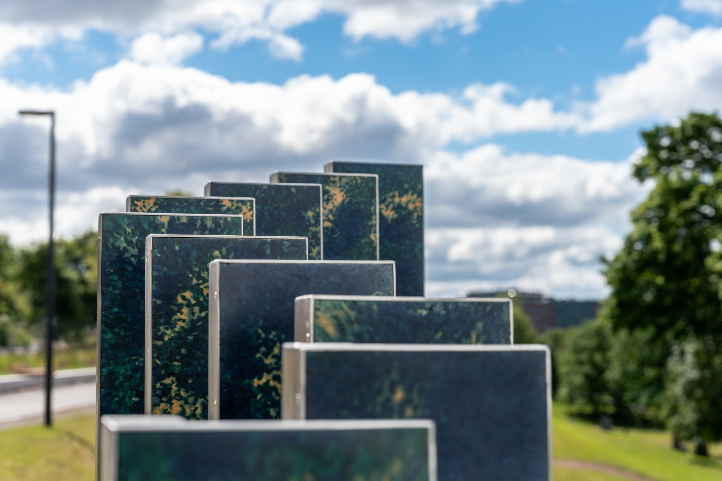 Detail of the colourful, speckled recycled marine-plastic panels used to create Ocean Rise.