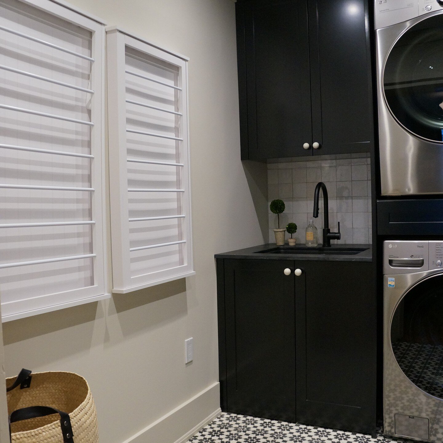 Thomas Design and Build recently finished this design forward, functional and durable laundry room. It's always the smaller spaces that are most difficult to design. Storage and functionality are key. We decided on a stacked washer/dryer with a pull-