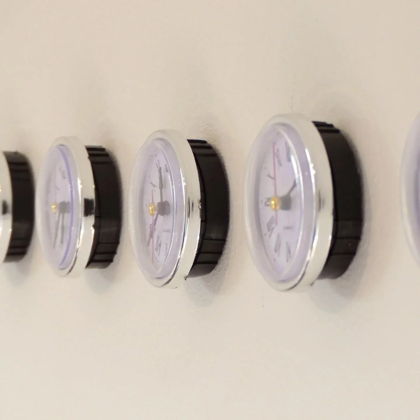 // Issue 72 - The Liminality of Time //

Artist: Cameron Lings

www.cameronlingsart.co.uk

@cameron_lings_

'_______, Anyplace, Anywhere'

Description: An installation consisting of a series of analogue clocks, each displaying a different time throug