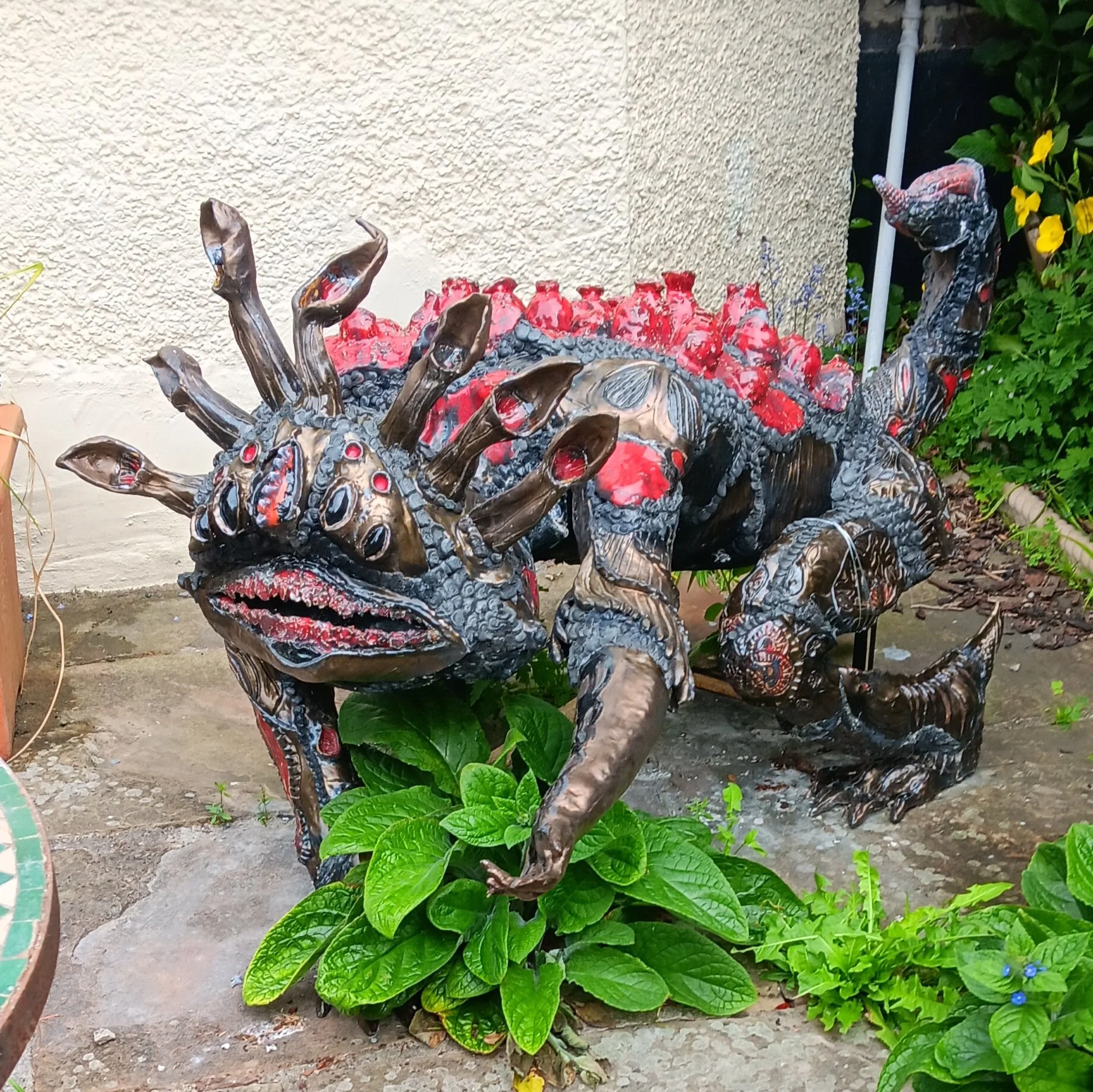 ceramic sculpture of a creature