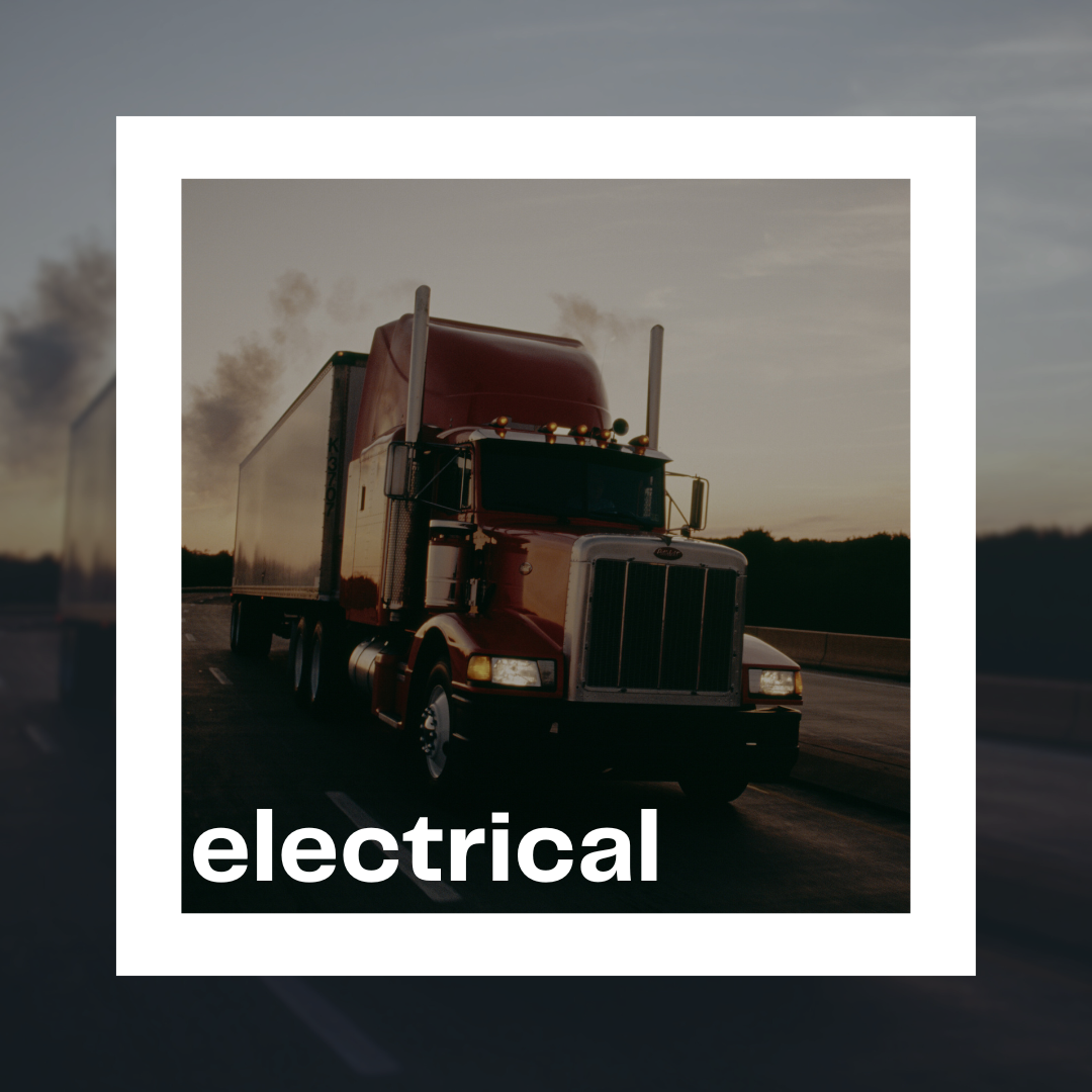 a semi tractor with headlights on