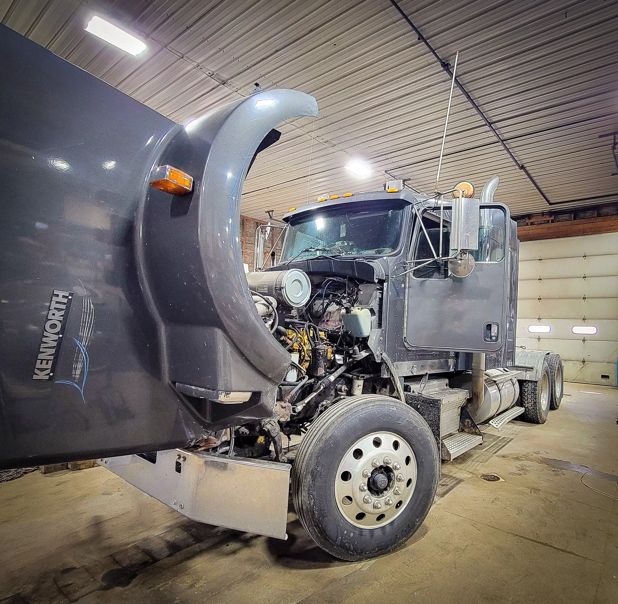 a kenworth semi tractor in for engine work