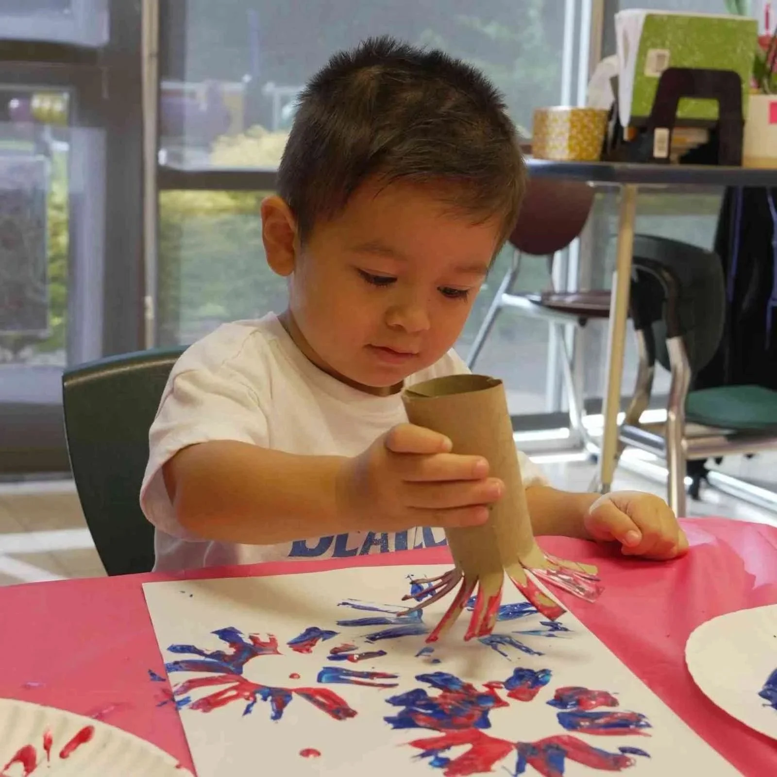 A Student of Montessori engages in a learning craft activity in Allen, TX, a summer enrichment program
