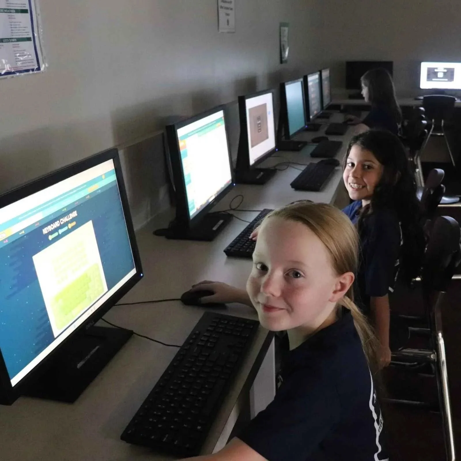 Montessori student participating in the signature STEM program in Allen, TX, computer classroom
