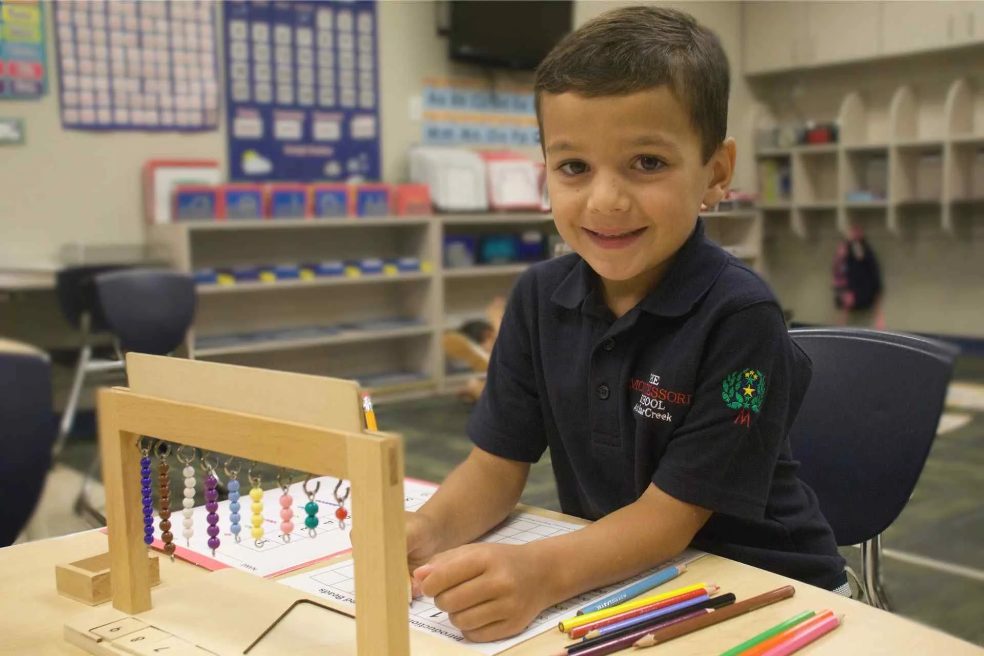 Student using Montessori bead frame in Allen, TX