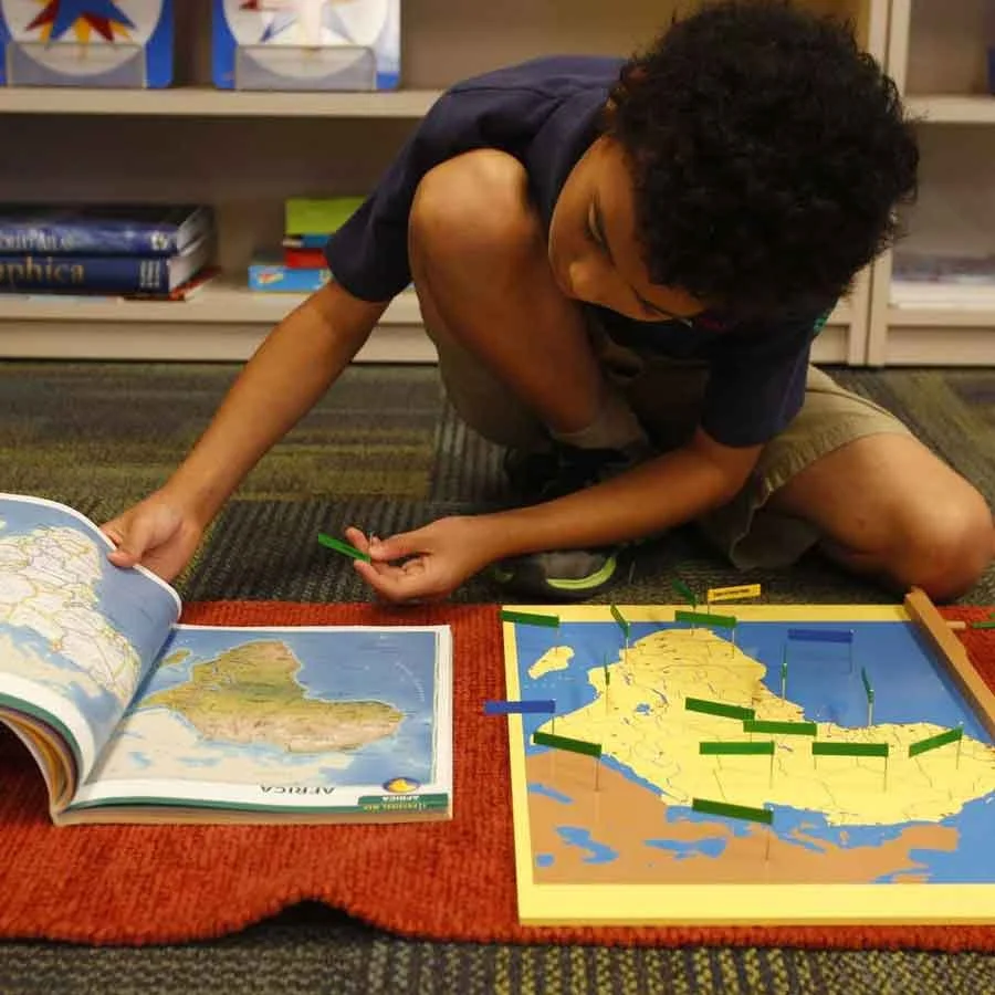 Young Montessori learners participating in a collaborative elementary classroom activity in Allen, TX