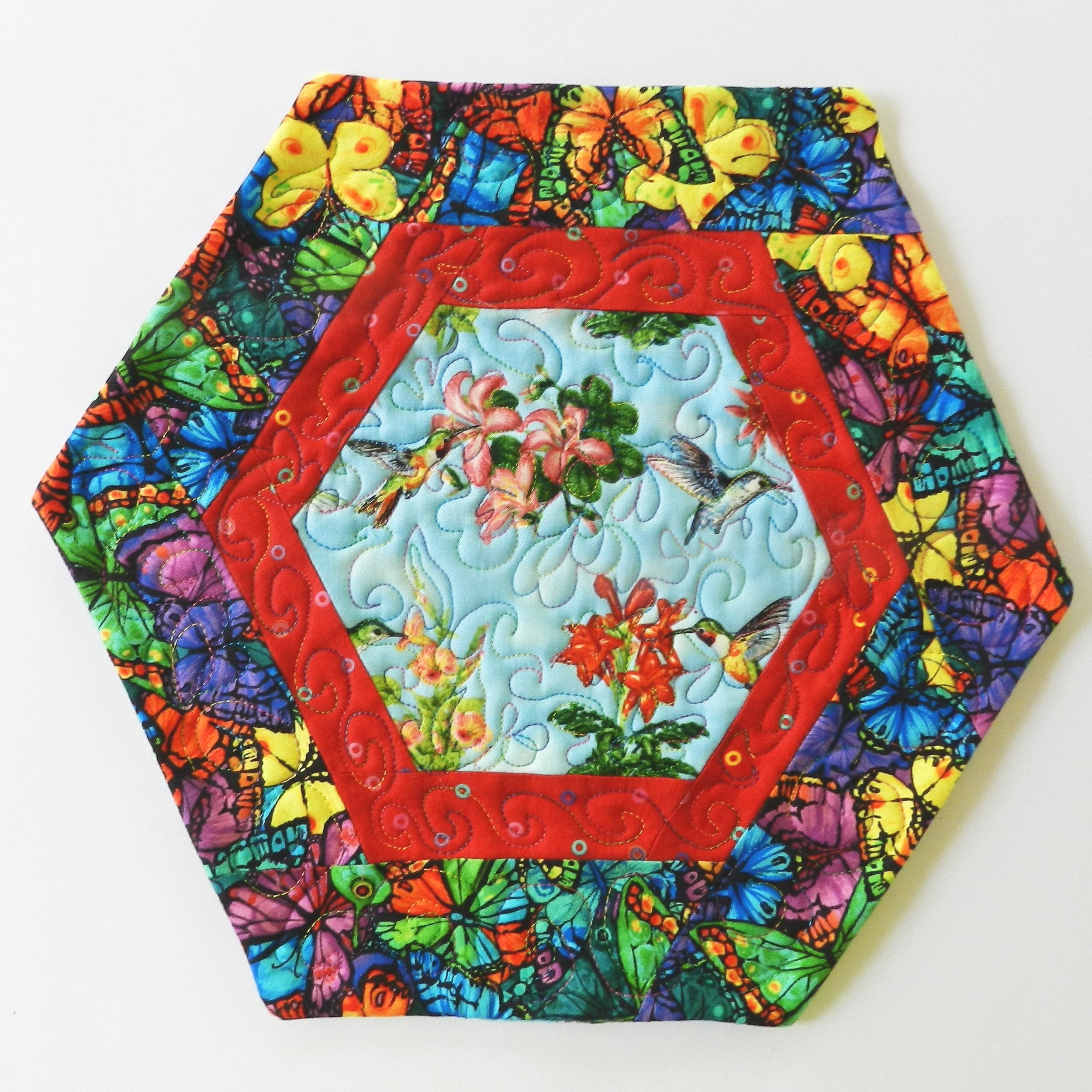Blue+Hummingbirds+and+Packed+Bright+Butterflies+hexagon+Table+Mat+Front+Side.jpg