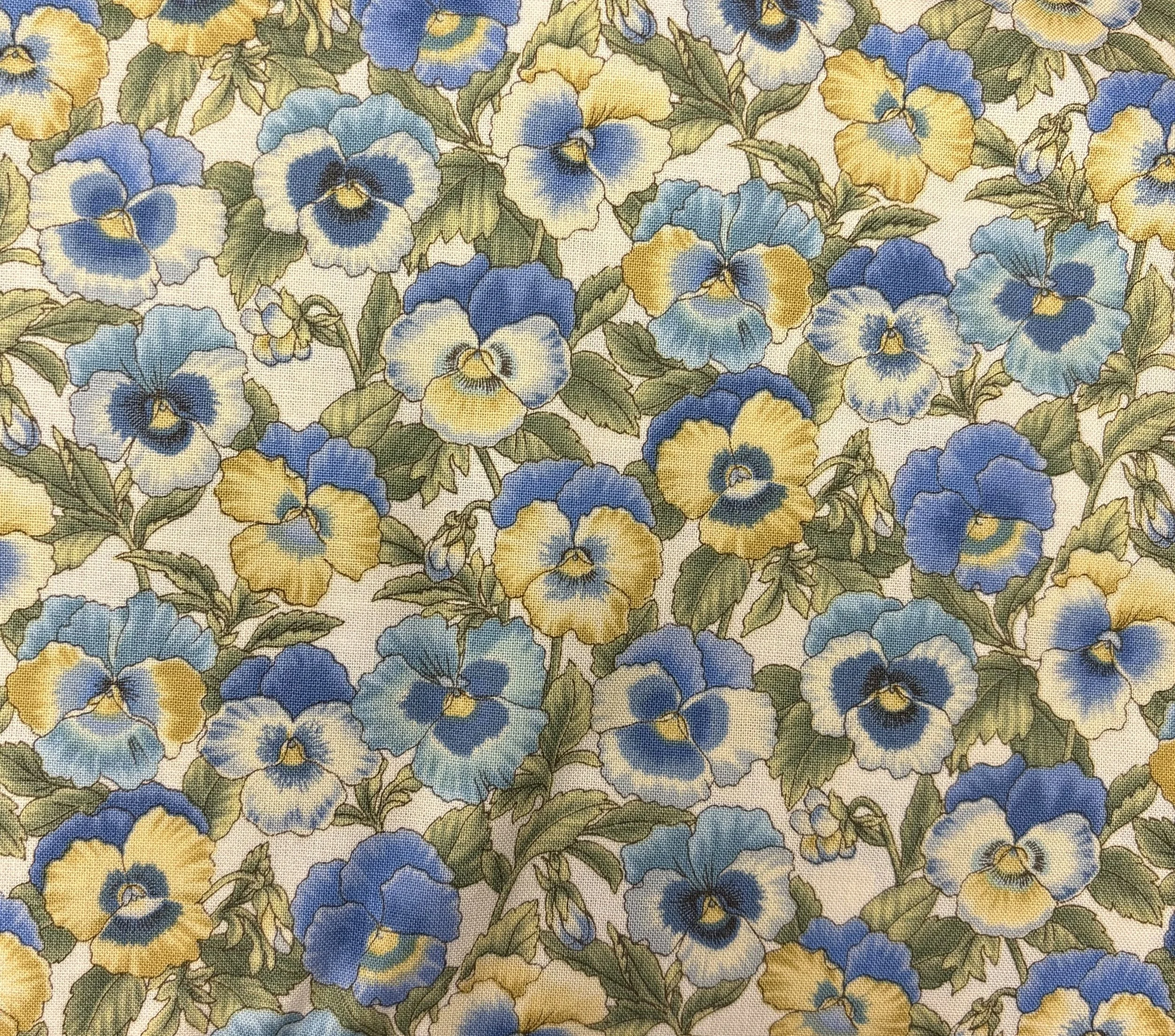 White. Yellow, and Blue Pansies by Benartex
