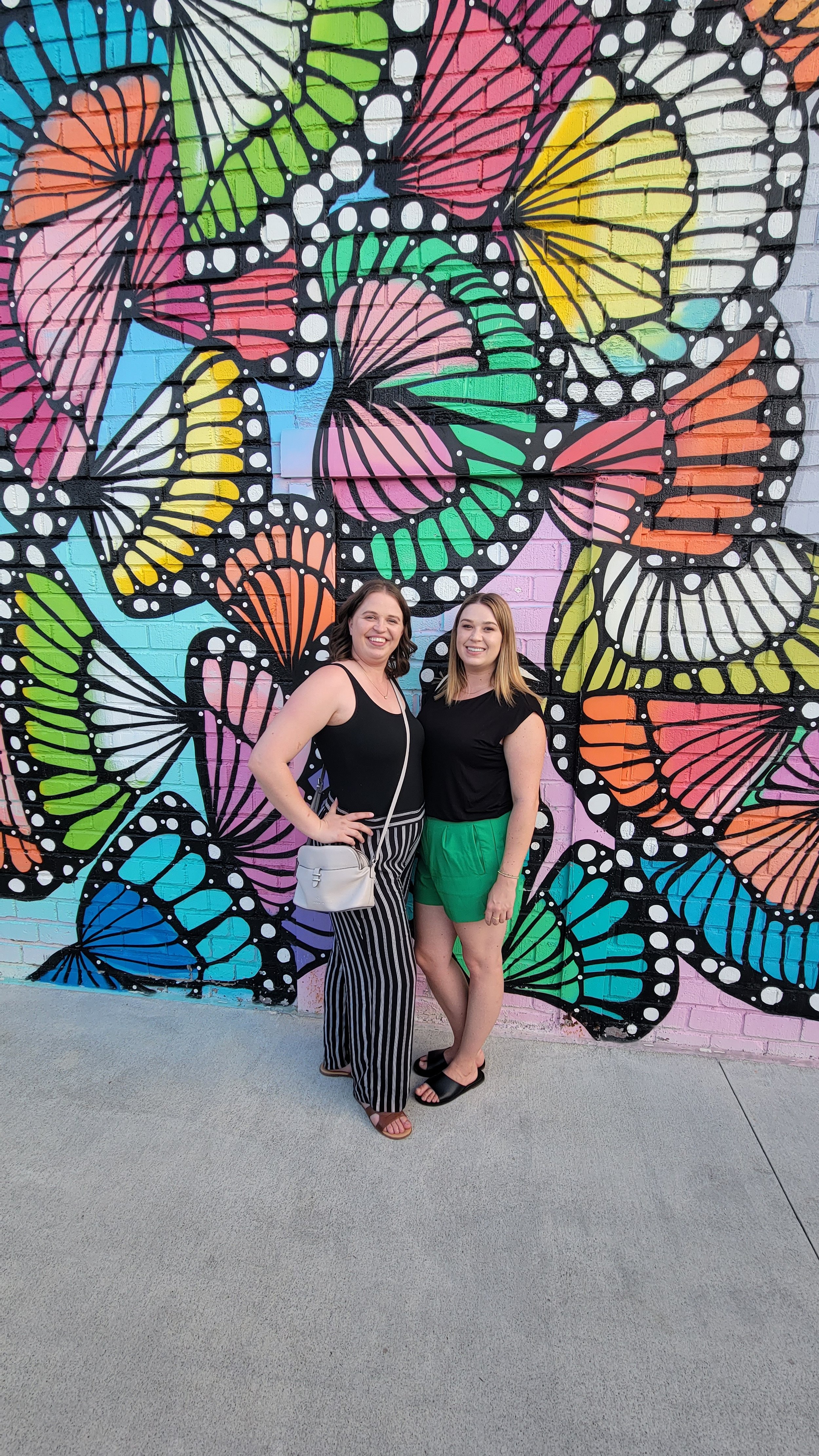  Another obligatory photo with my sister-in-law, in front of the gorgeous butterfly mural outside of Chattahoochee Food Works 