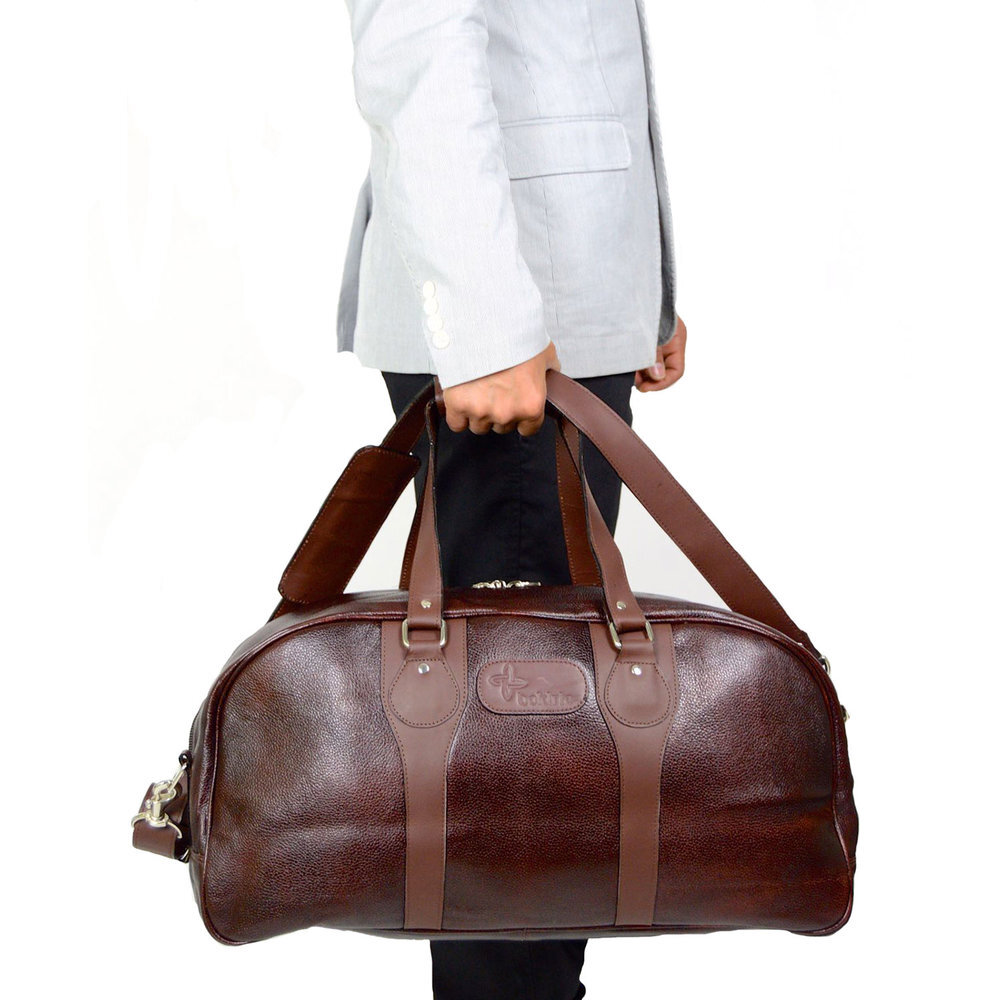 A Concept Depicting An Open Brown Leather Duffel Bag Revealing
