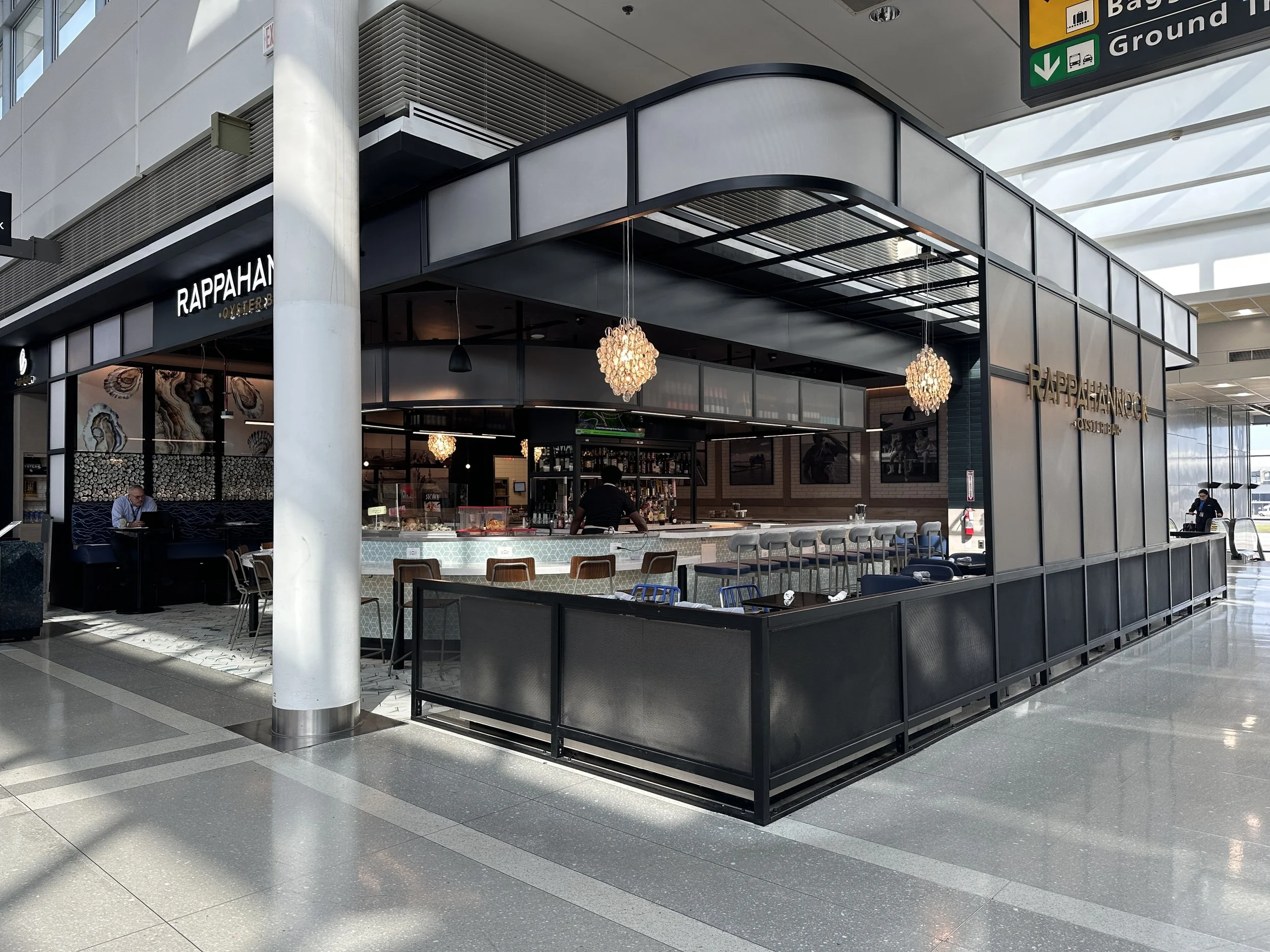Rappahannock Oyster Bar at IAD Airport, designed by Silhouette Design Architecture