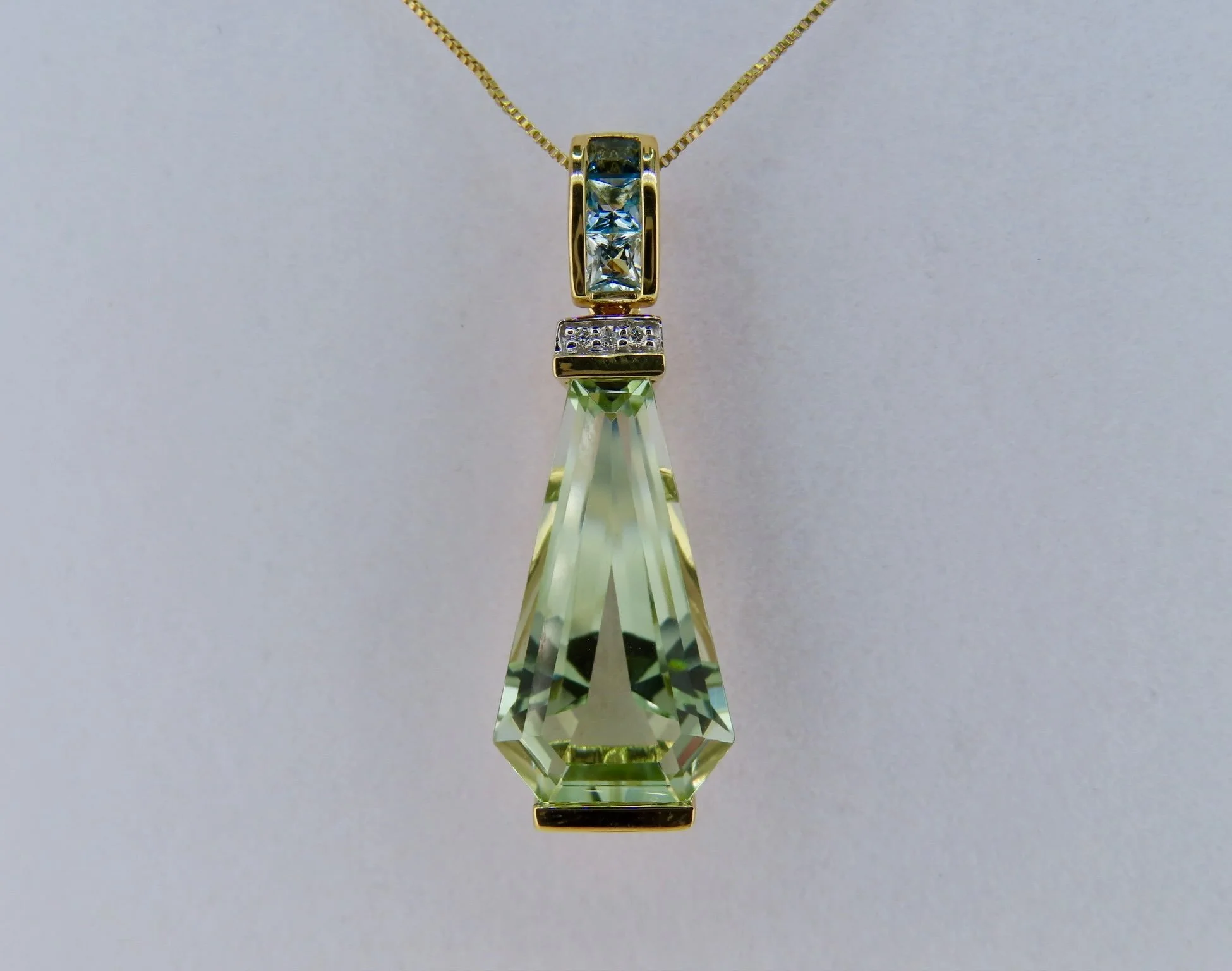 Another gorgeous new arrival: 14K Gold Green Amethyst, Diamond &amp; Blue Topaz Pendant 😍

Soft color meets brilliant sparkle in this elegant statement piece. A beautifully faceted green amethyst is accented by sparkling blue topaz and delicate diam