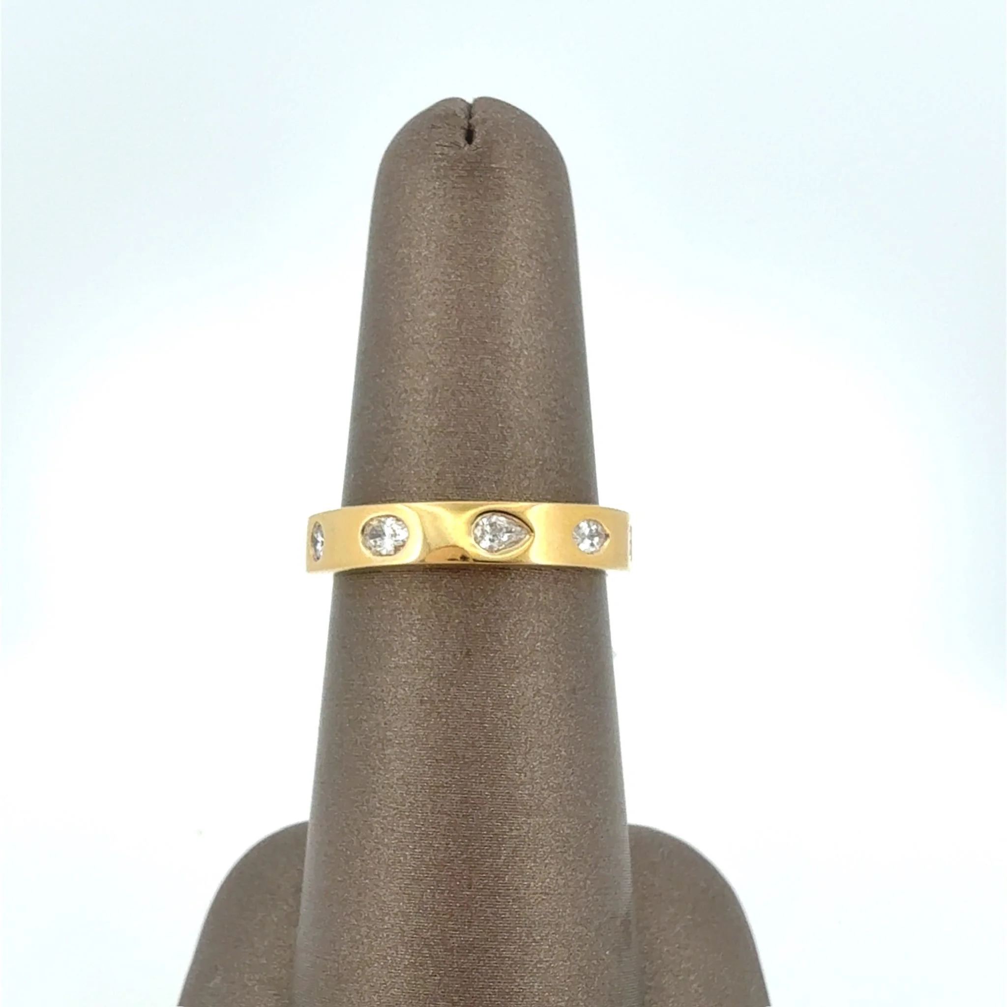 One of our newest favorites: Yellow Gold Bezel-Set Diamond Band ✨

Crafted in 14K yellow gold, this diamond band features a beautiful mix of round, marquise, oval, emerald and pear-shaped diamonds, each nestled in a sleek bezel setting. The combinati