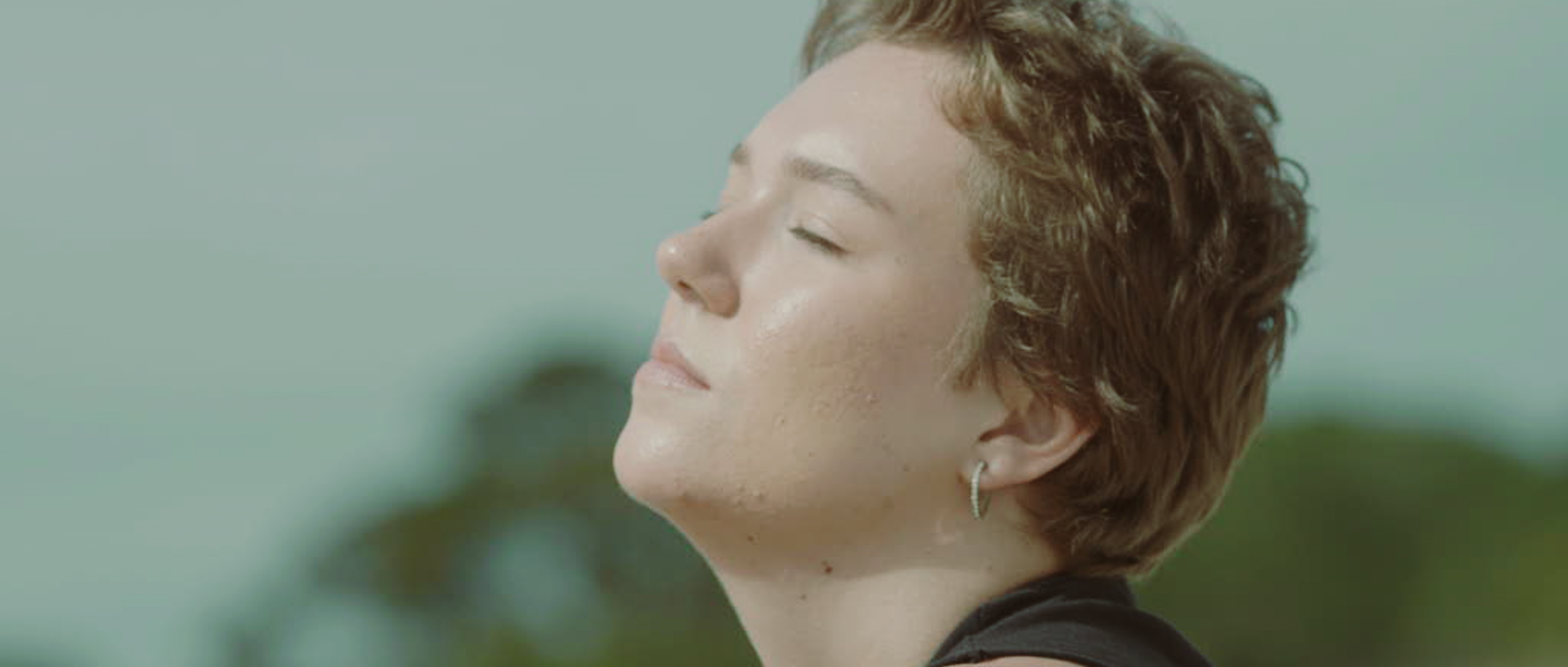 RAE LOOKING INTO SUN.png