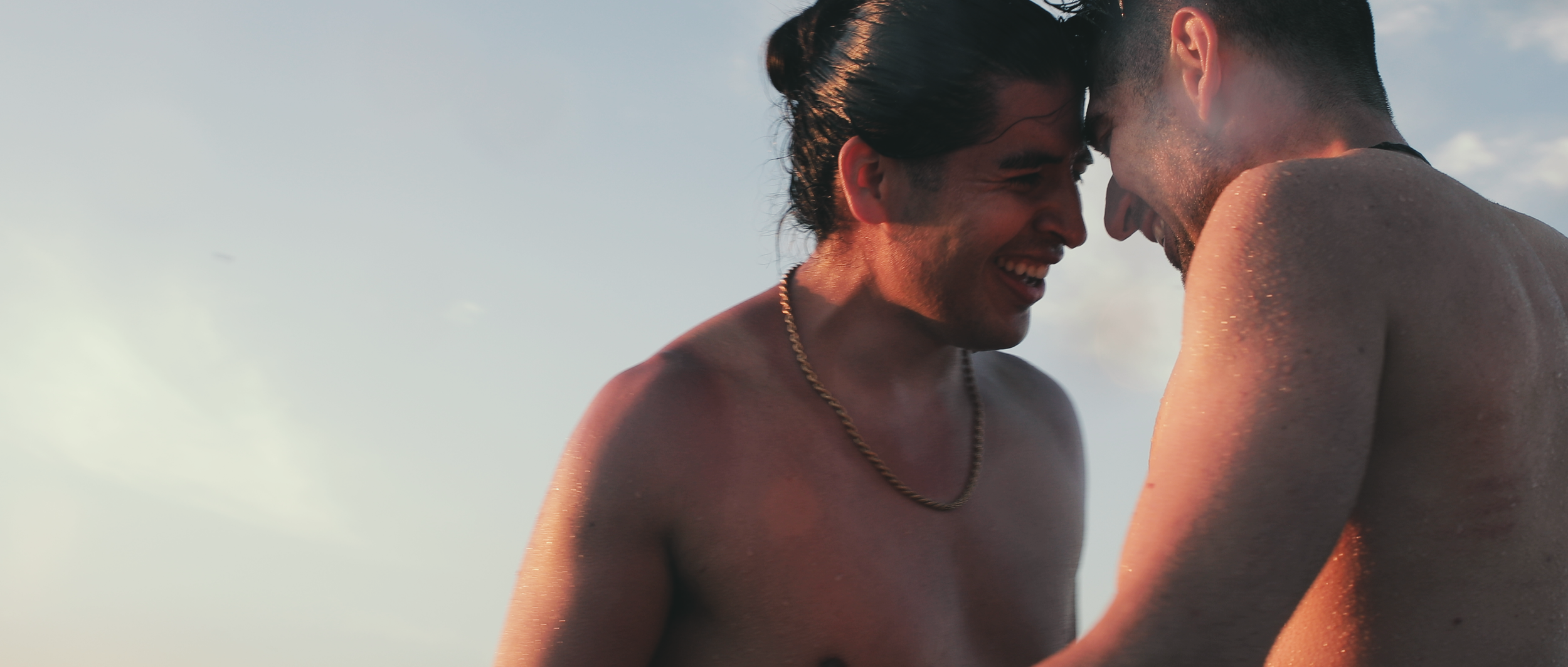 guy and phil in the water smiling.png