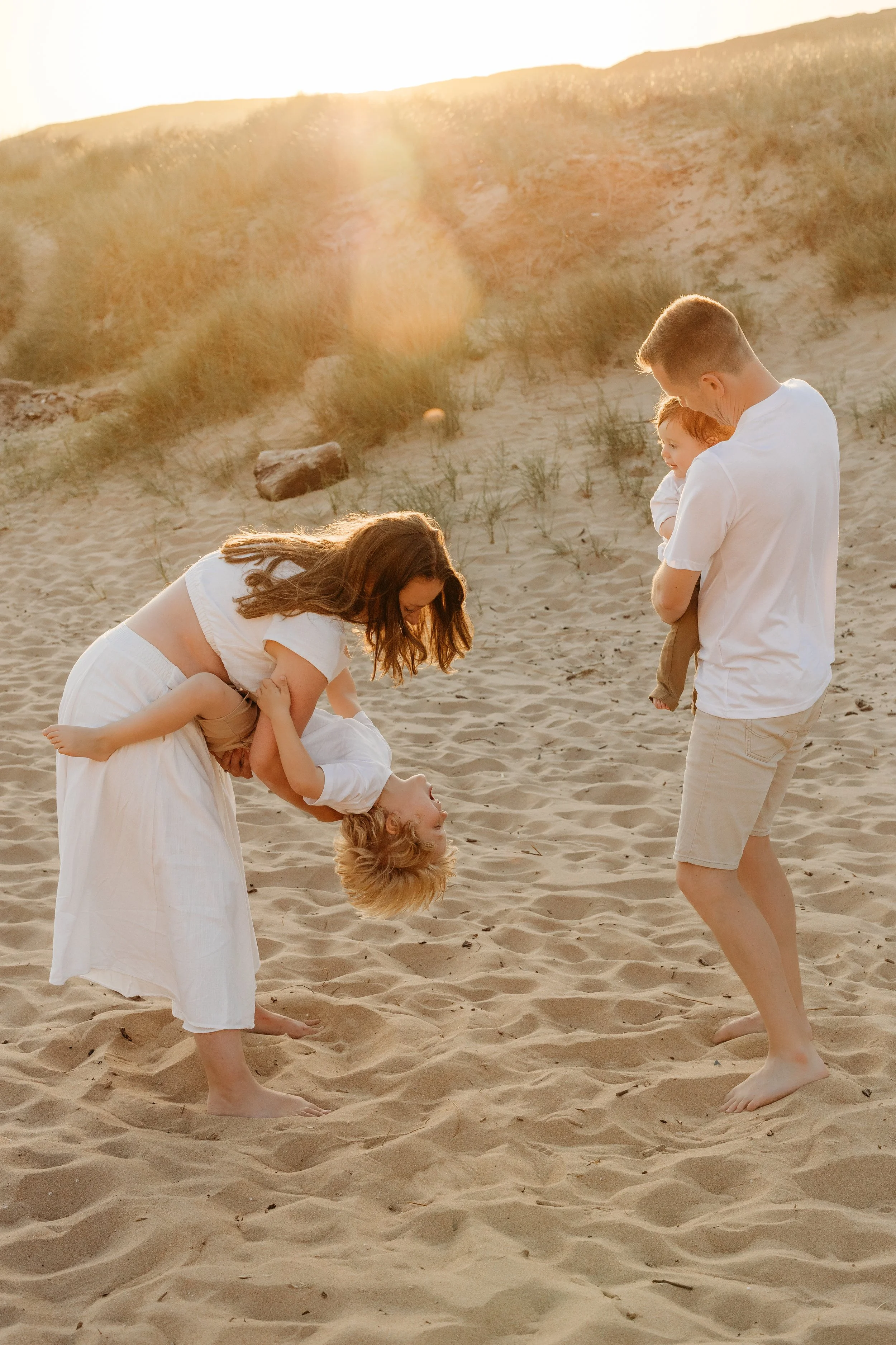 Family playing on the beach