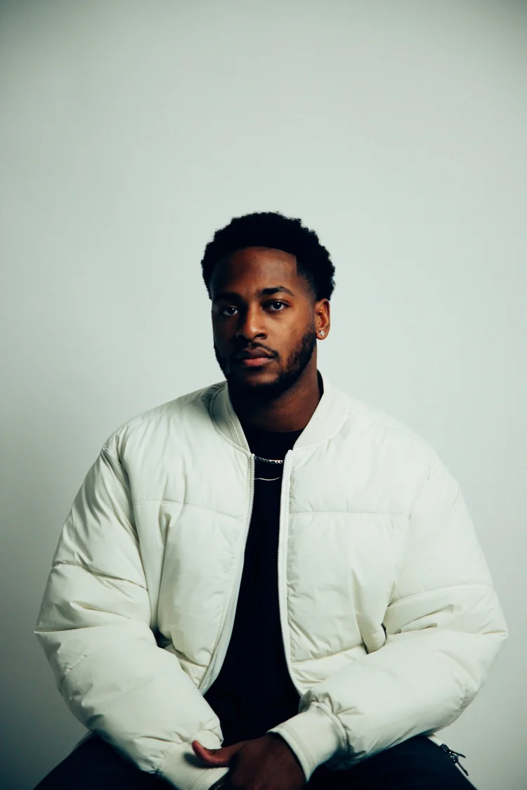 Portrait of MvkeyyJ in a white jacket