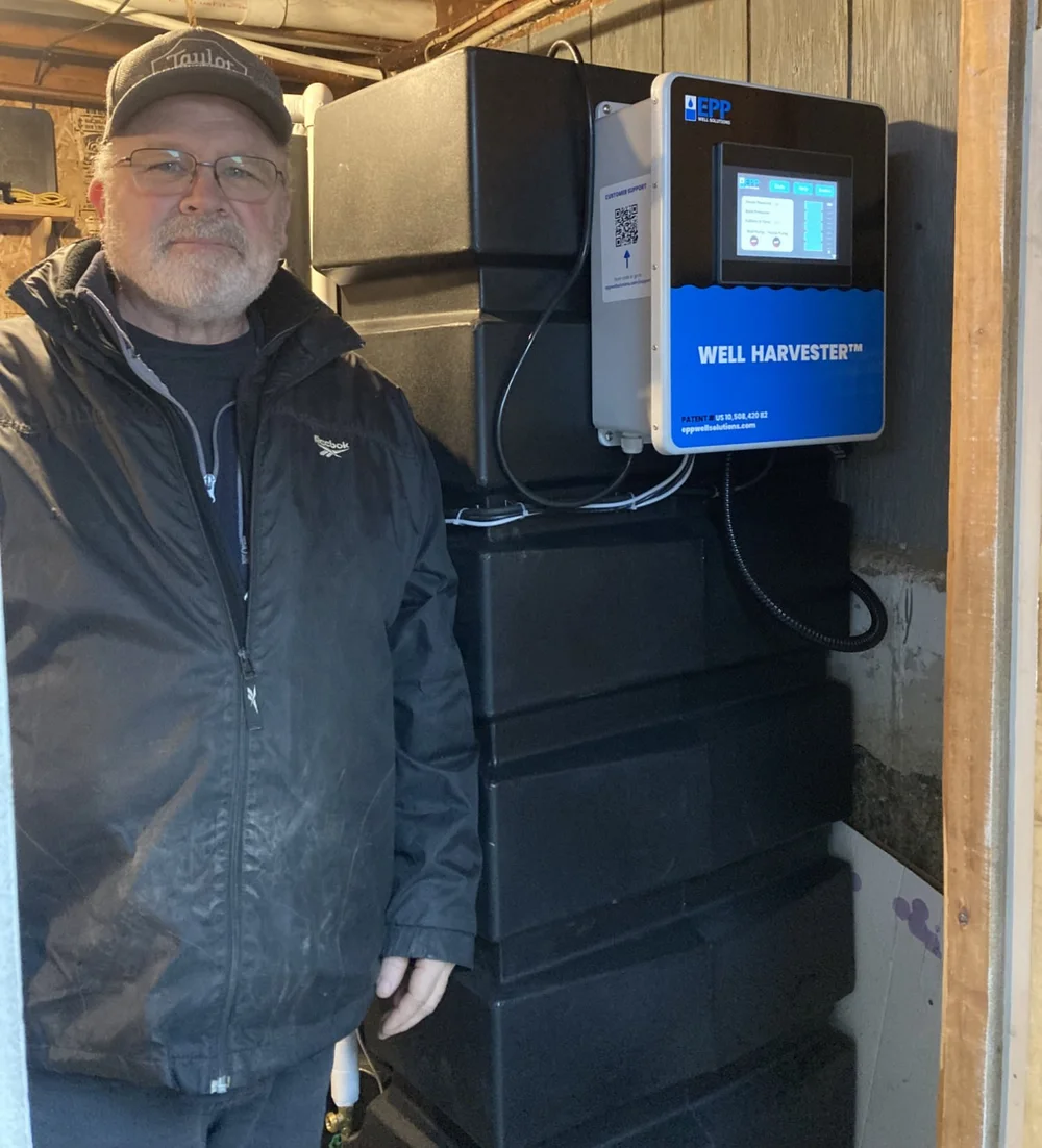 Bob standing beside the Well Harvester installed at Palermo Christian Church
