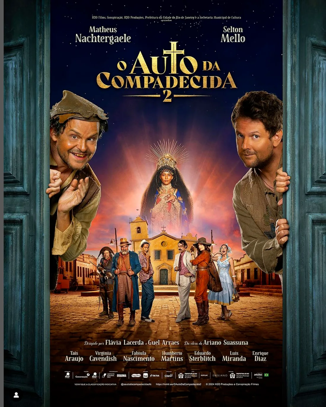 Poster of the movie 'O Auto da Compadecida 2' featuring cast members and a religious figure against a sunset village backdrop.