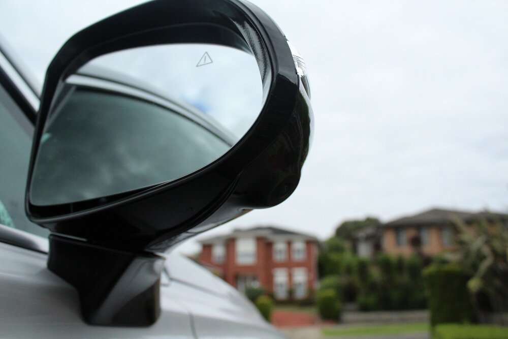 Door-mounted mirrors aid outward vision, especially when turning..
