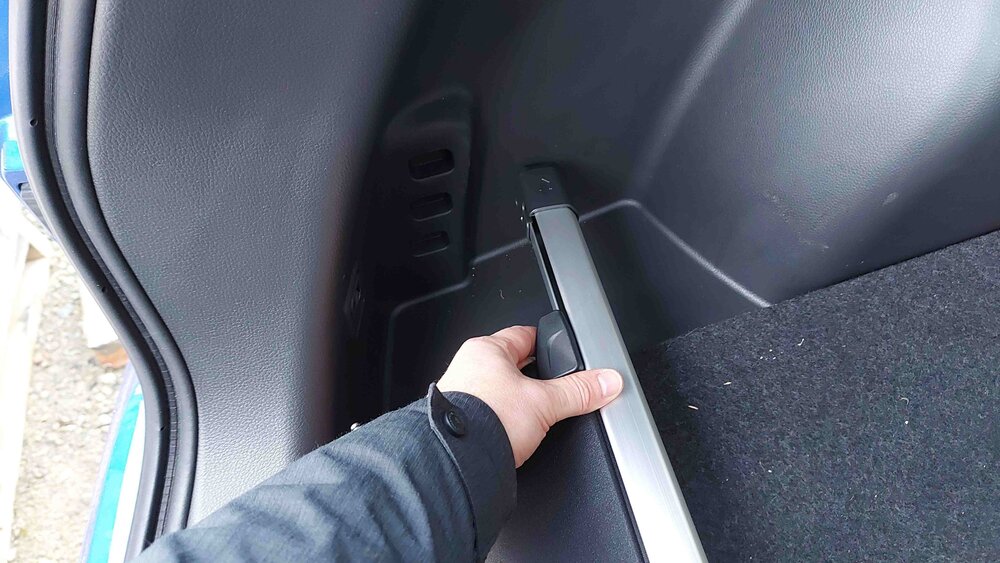 Cargo cover clips into the boot walls, acts as a barrier to stop things falling/sliding out.