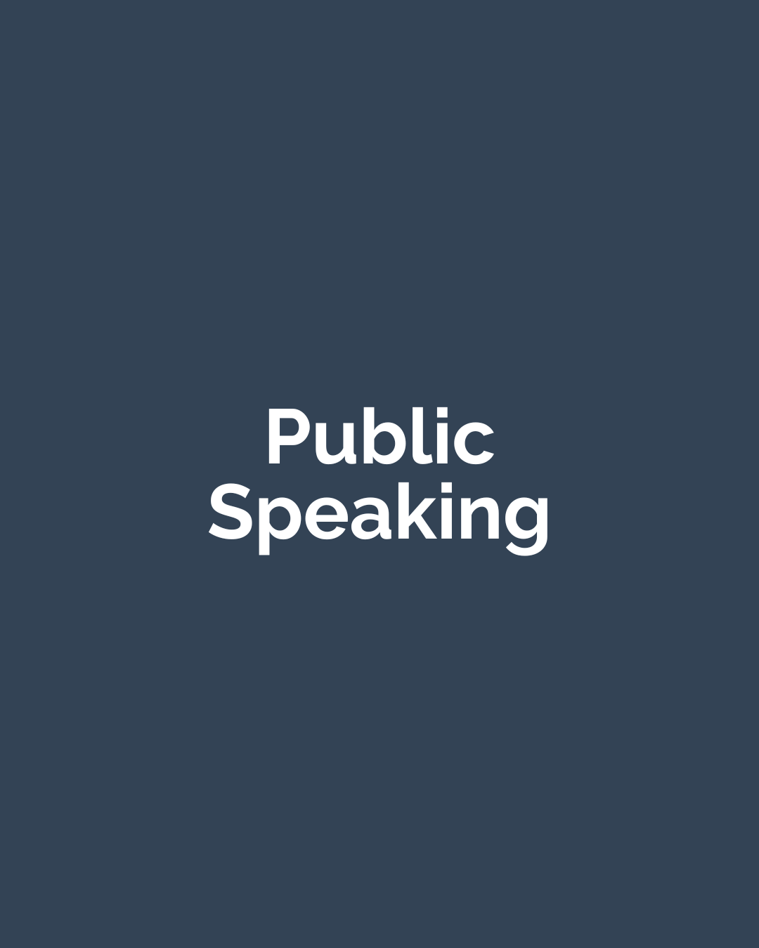 Kevin May speaking at a keynote conference presentation to a groupat a podium.
