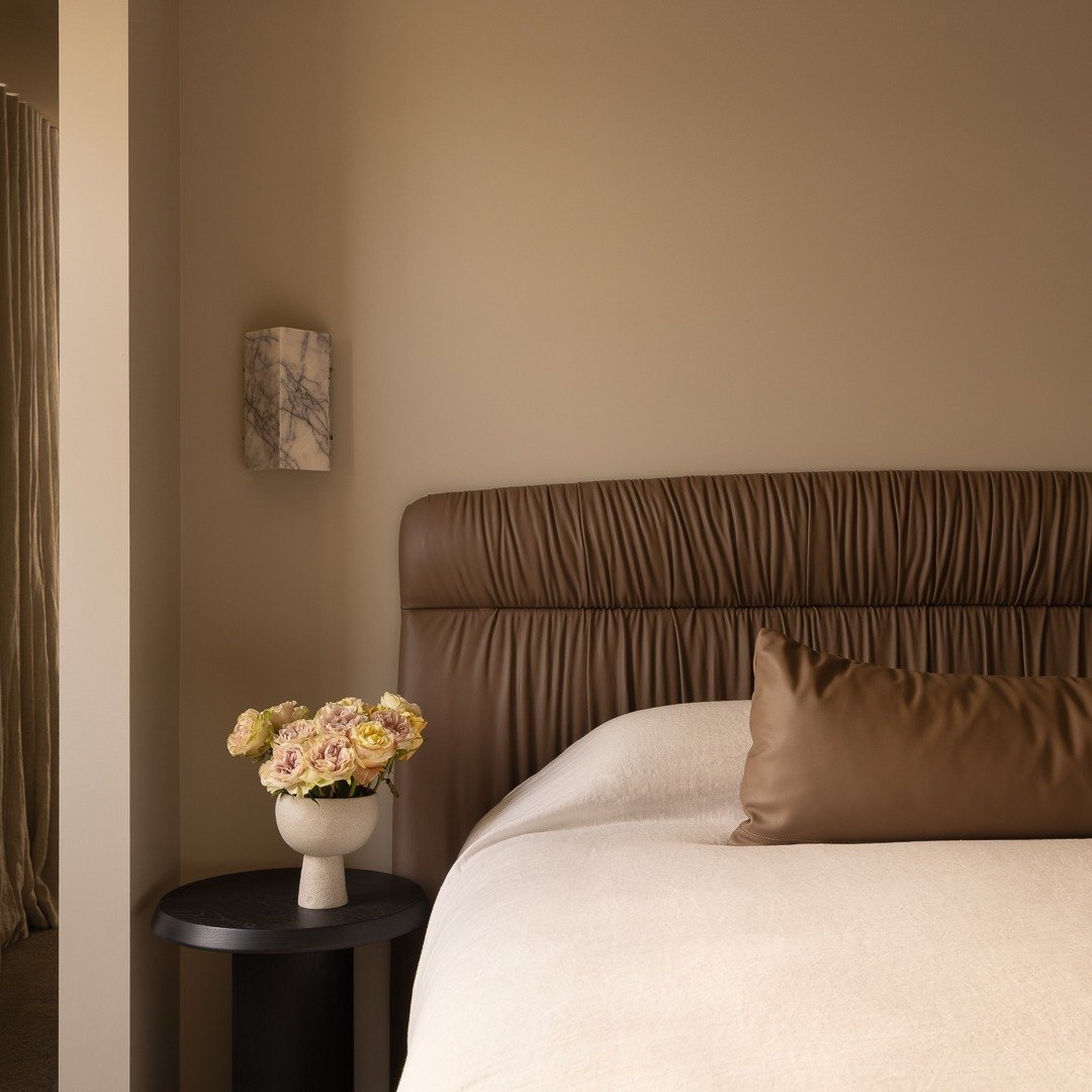 A leather wrapped bed ensemble, custom designed to explore the richness and tactility of leather. The subtle folds and clean lines are thoughtfully considered, creating a piece that is both tactile and sculptural. A refined anchor for the room, desig