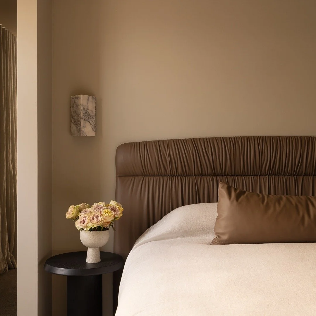 A leather wrapped bed ensemble, custom designed to explore the richness and tactility of leather. The subtle folds and clean lines are thoughtfully considered, creating a piece that is both tactile and sculptural. A refined anchor for the room, desig