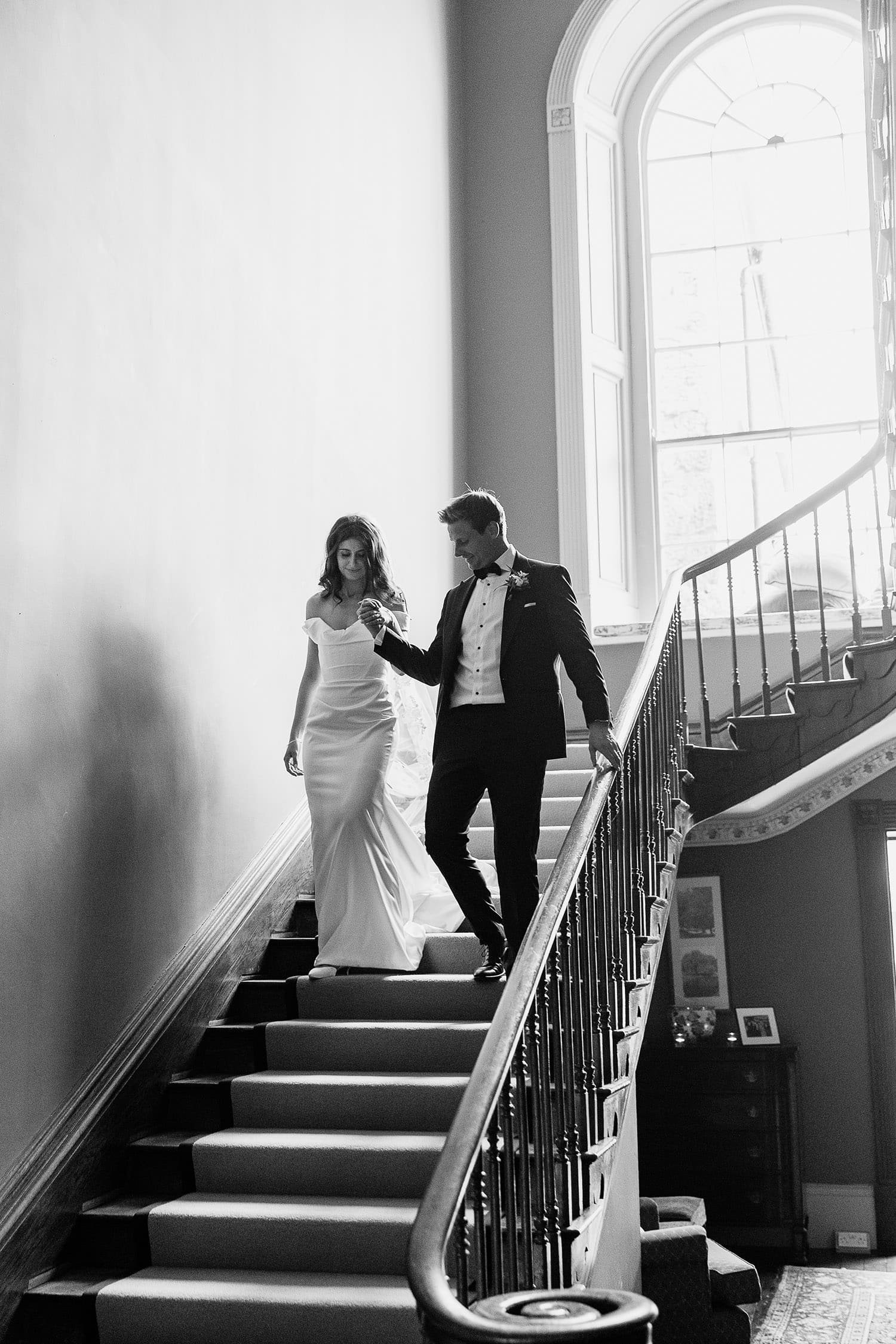 bride and groom on the grand staircase in Kilshane House