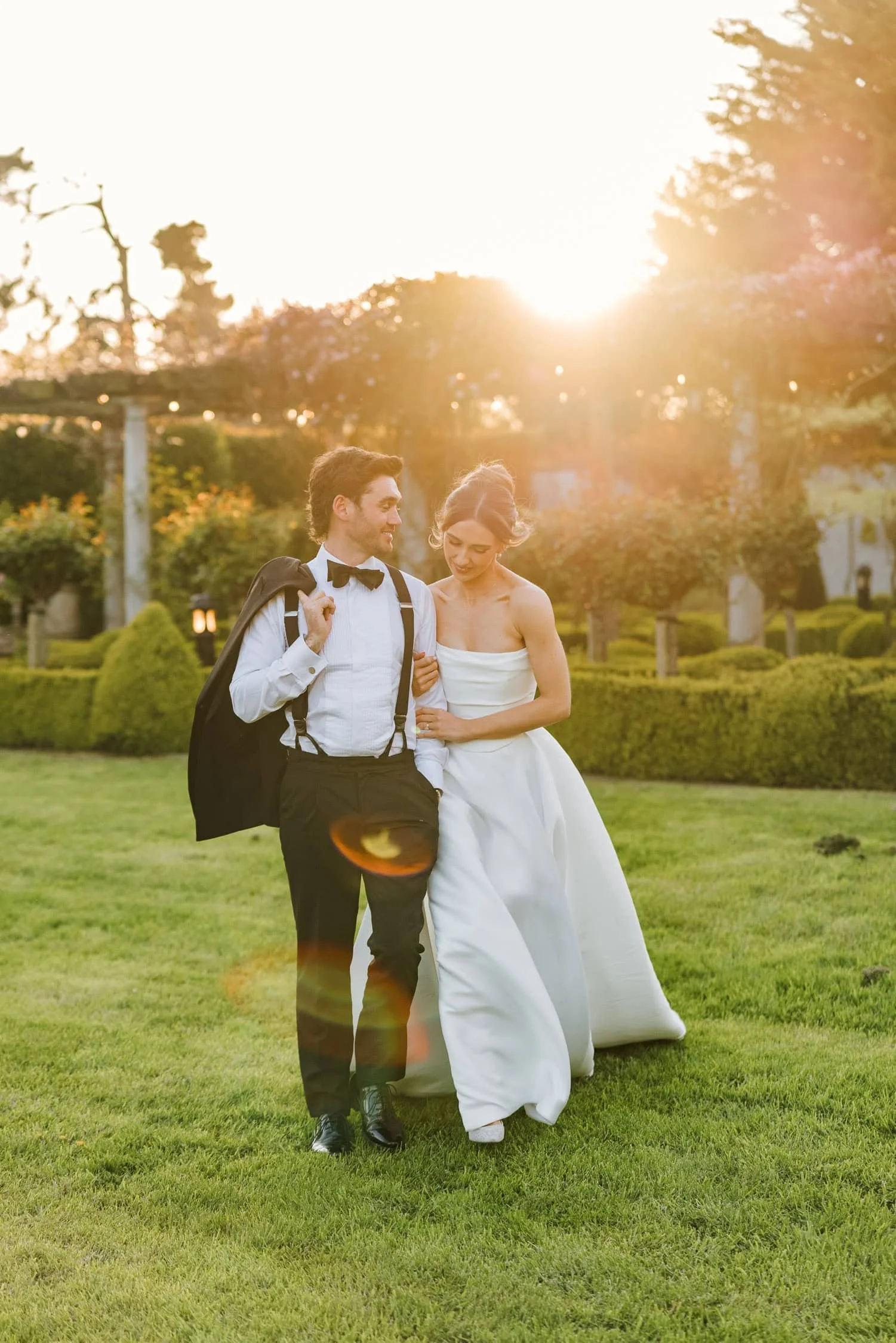 Bride and groom at sunset in Bellingham Castle garden