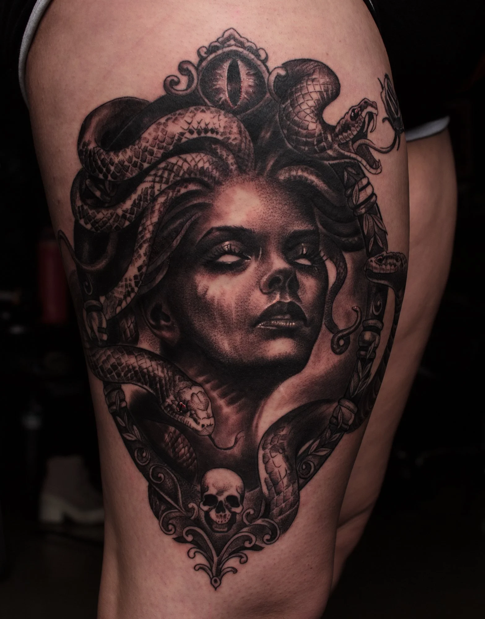Medusa tattoo in an ornate frame