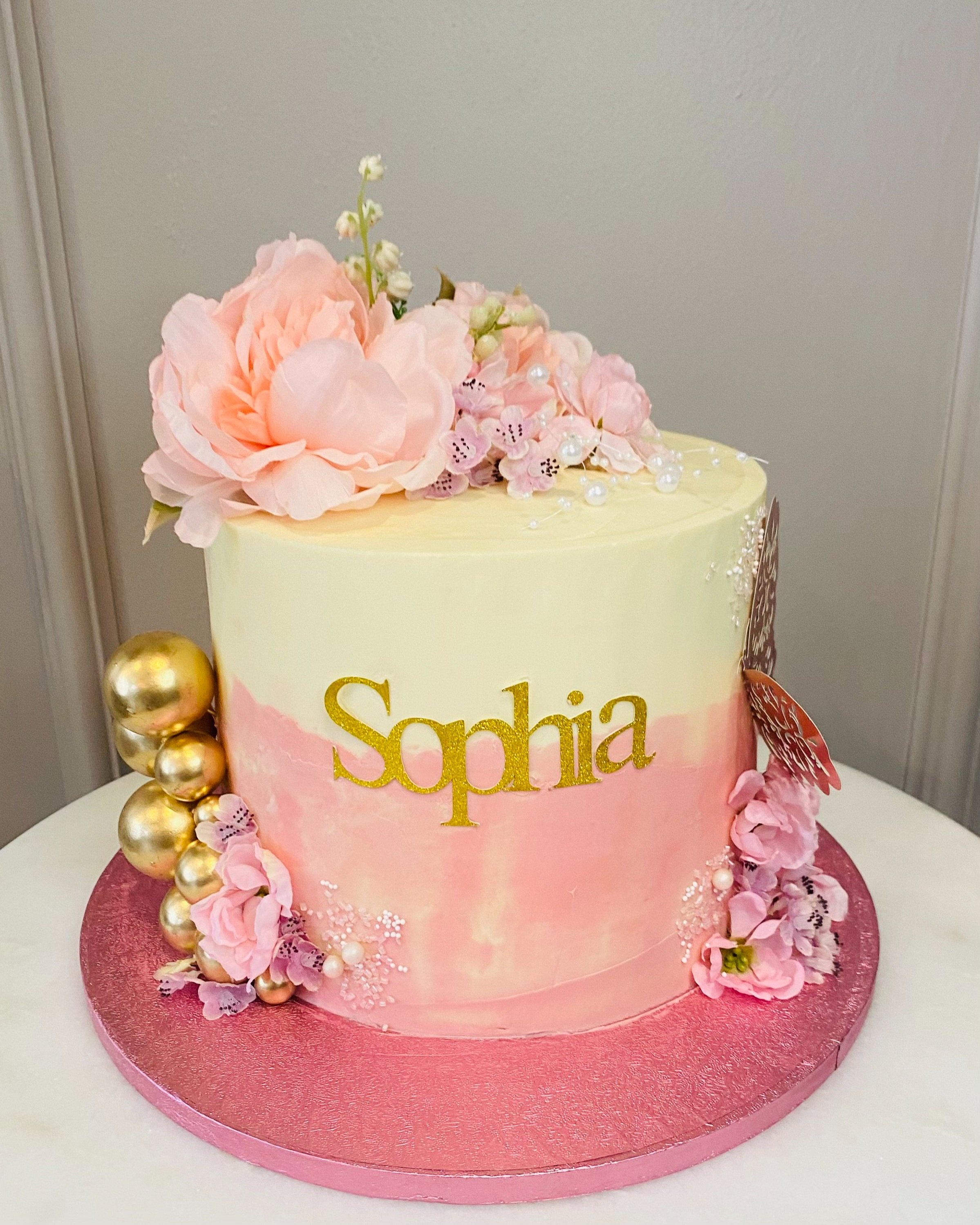 Marble+Cream+and+Pink+communion+cake+with+name+on+front+Gold+decoratives+balls.jpg