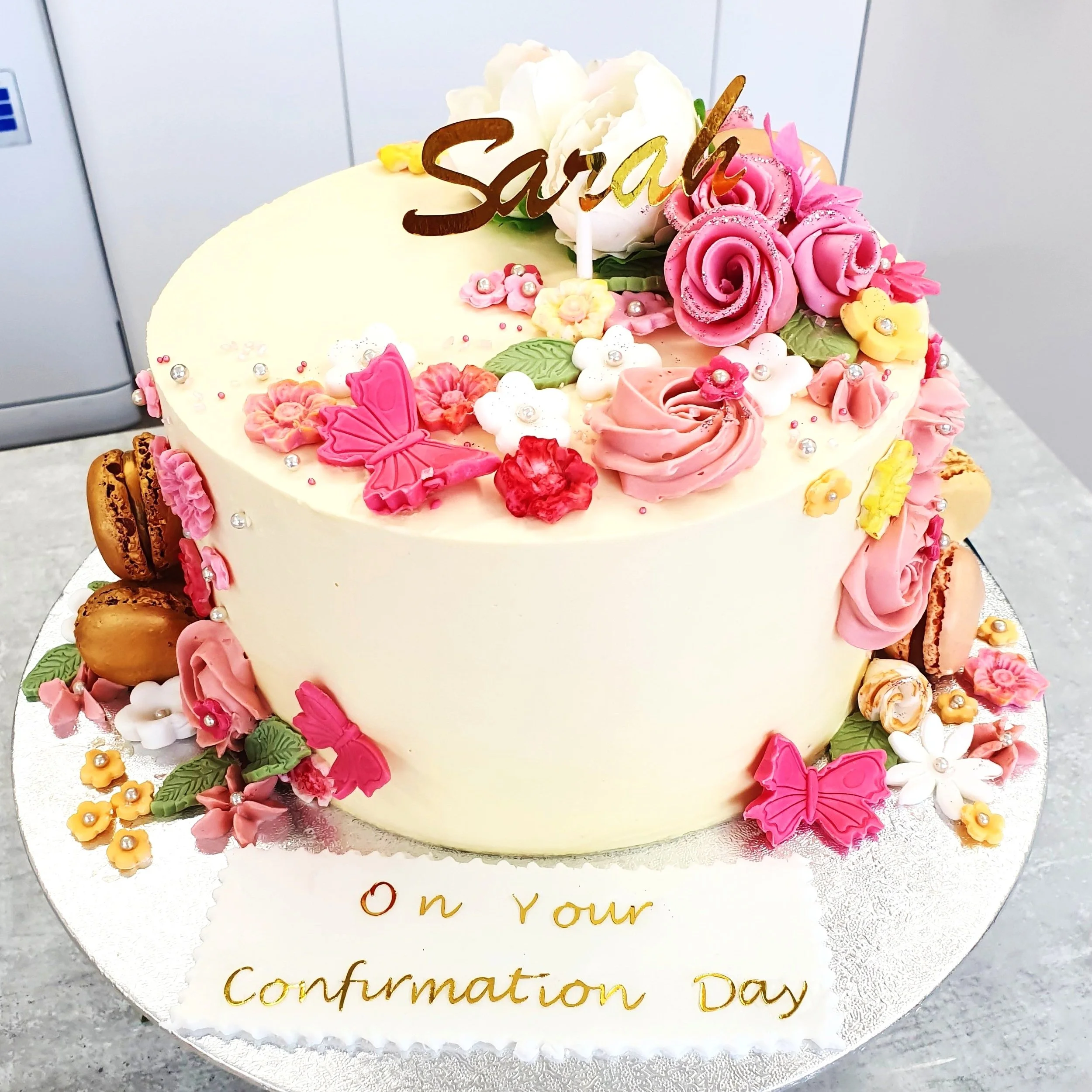 Confirmation Cake for Her with details in Flowers and Butterfly made in Fondant