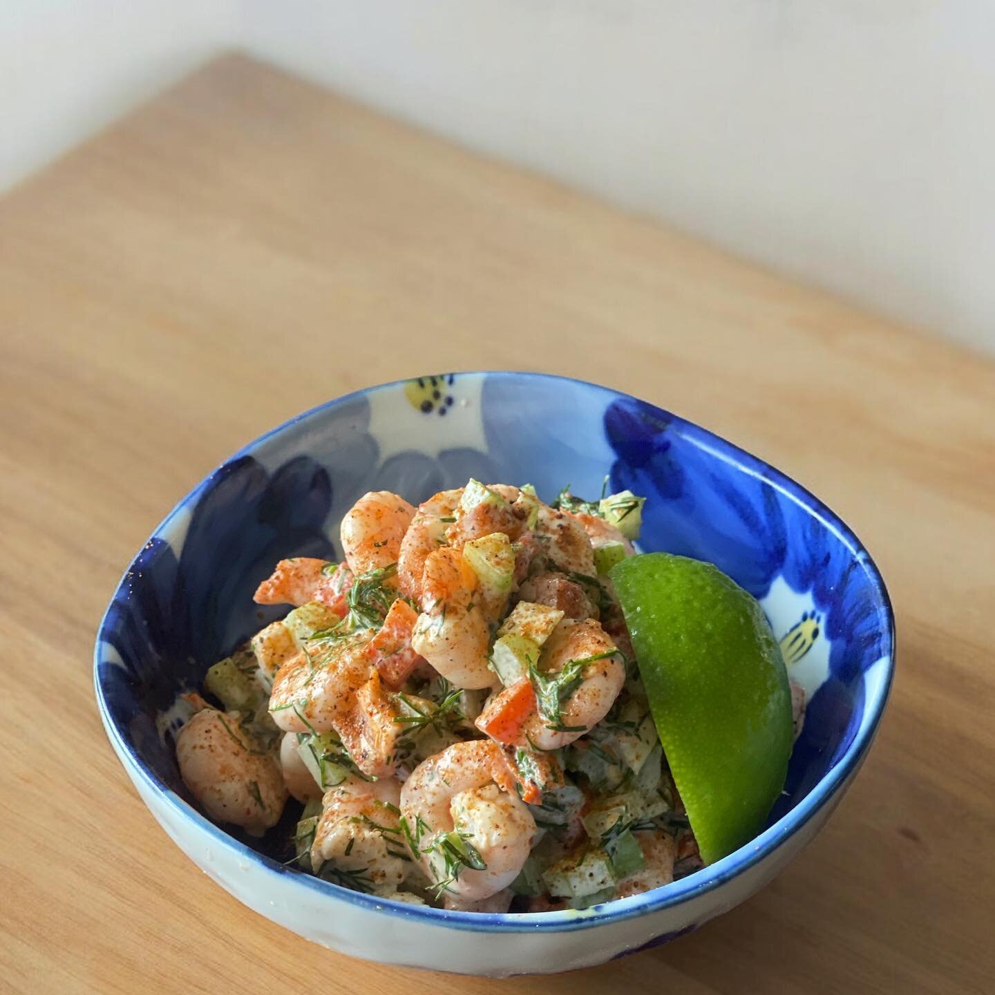 Absolutely delicious prawn salad. 
Very simple to make. We got inspired by 

Cook your prawns in water with cayenne pepper, garlic, bay leave, lemon juice, salt. When ready let them cool down. 

Dress prawns with chopped spring onions, dill, bell pep