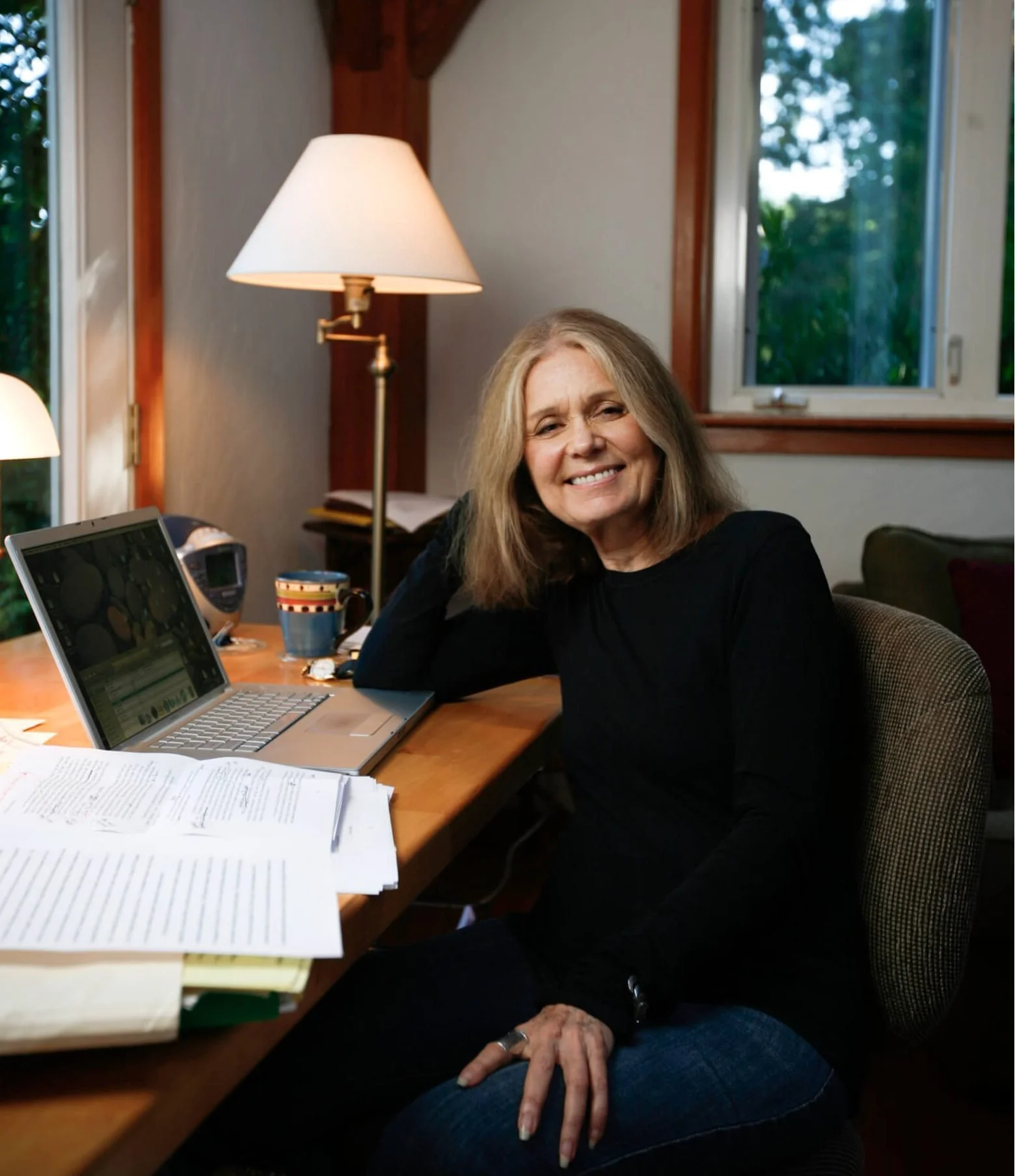 Gloria Steinem writing at a Hedgebrook cottage