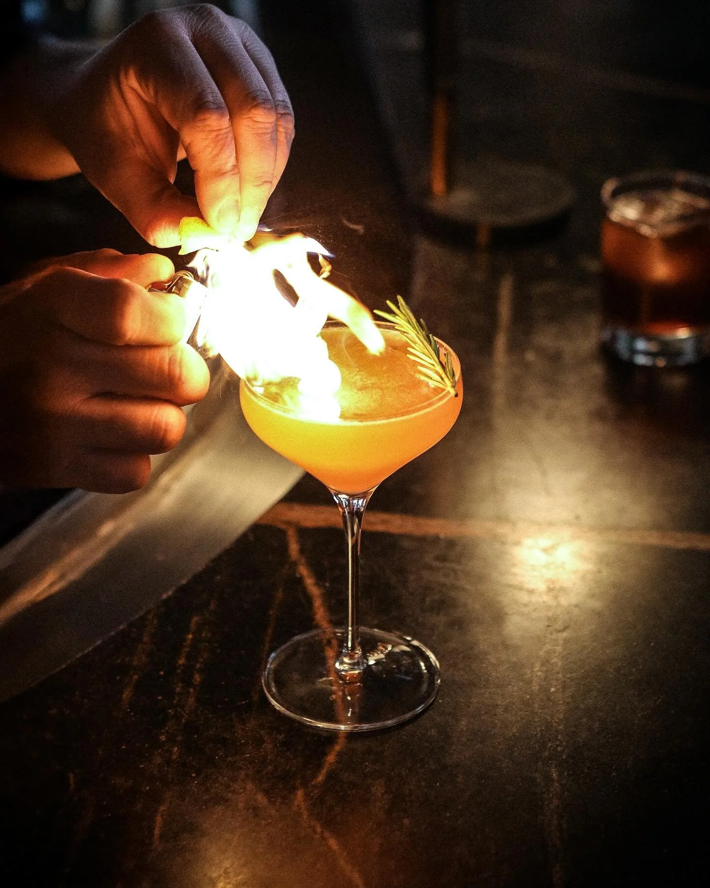 Elixir #3 🔥 

House-Selected Gin, Apple Cider, St. Germaine, Lemon, Demerara Simple, Rosemary Infused Chartreuse, Flamed Grapefruit.