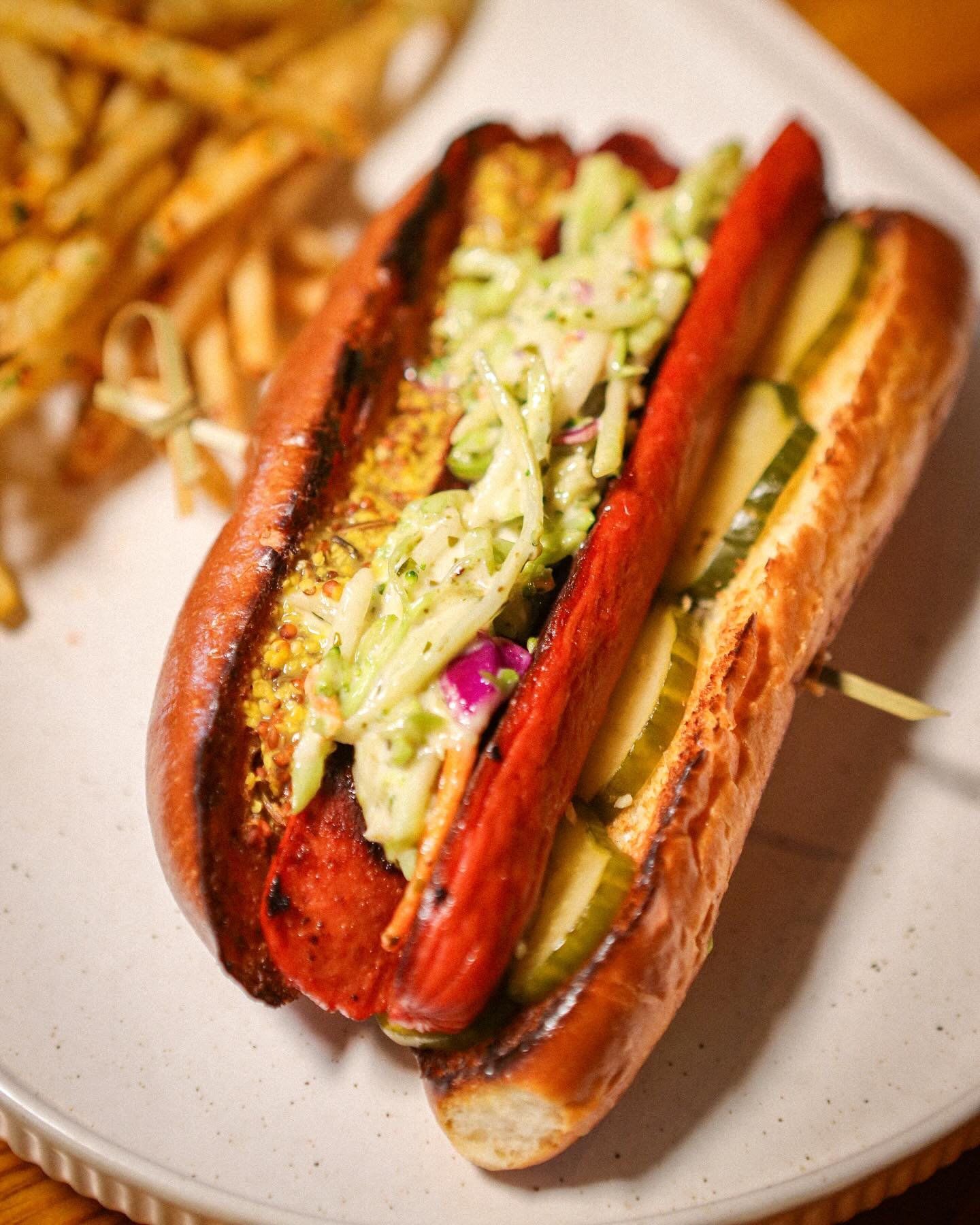 A fancy dog 🌭 

Angus Beef Hot Dog, Caraway Apple Cider Mustard, Green Goddess Slaw, Garlic Pickles, Toasted Brioche Bun.

Available on the lunch menu!