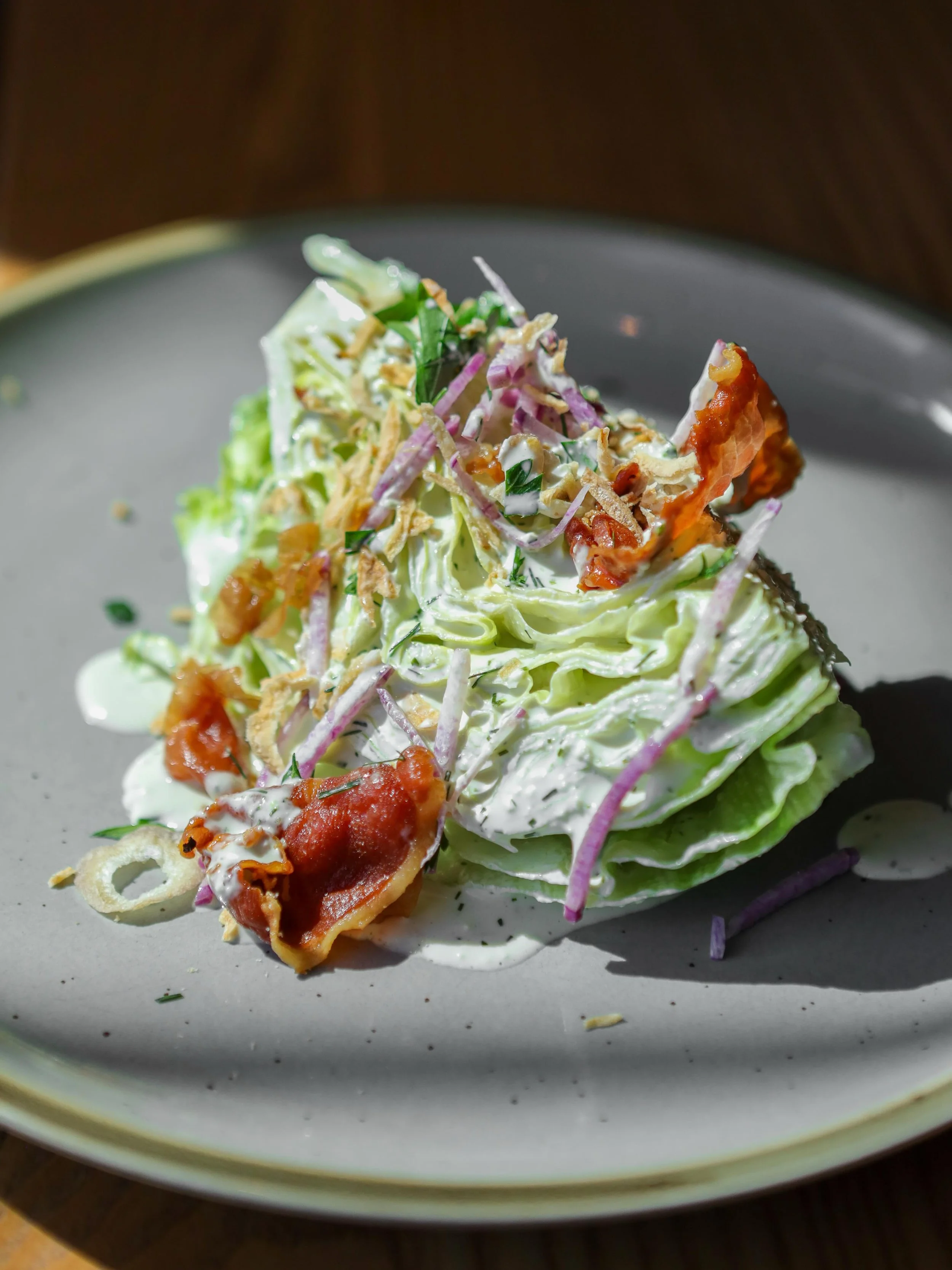 Wedge Salad 🥬🫜🥓 

Buttermilk Bleu Cheese Dressing, Radish, Dill, Crispy Smoked Prosciutto.