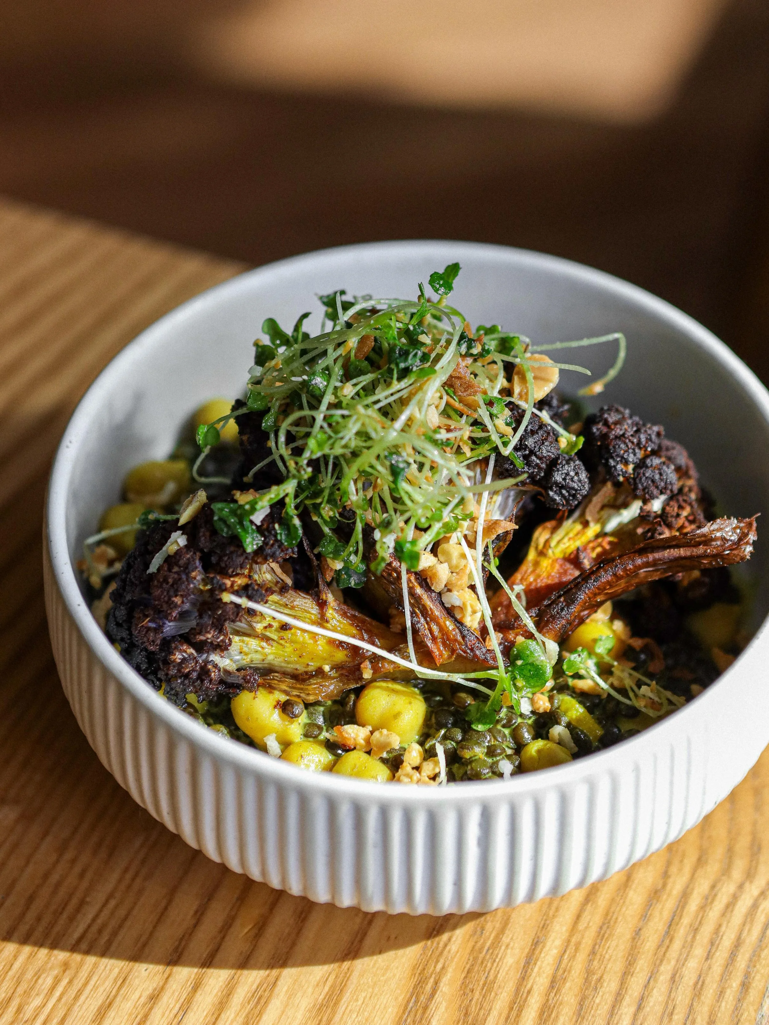 Roasted Cauliflower.

French Lentils, Chickpeas, Coconut Curry Sauce, Toasted Coconut, Peanuts, Herb Salad.

Available on dinner menu.