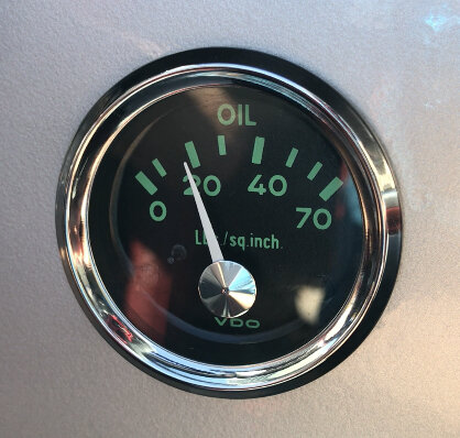 Car oil pressure gauge indicating approximately 20 psi.